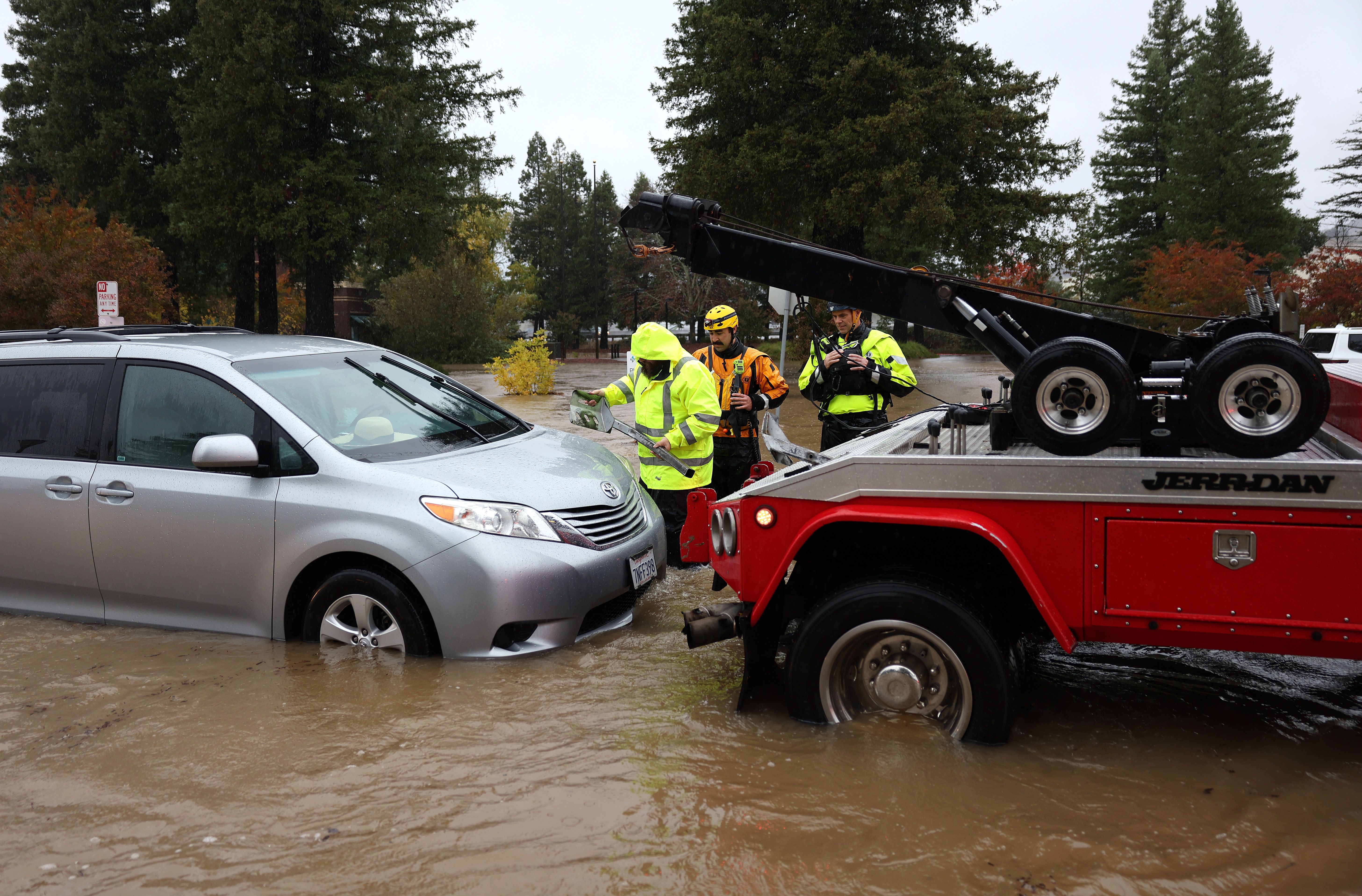  A tow truck prepares to pull a stranded car out of a flooded parking lot outside of Sutter Health on November 21, 2024, in Santa Rosa, California. 