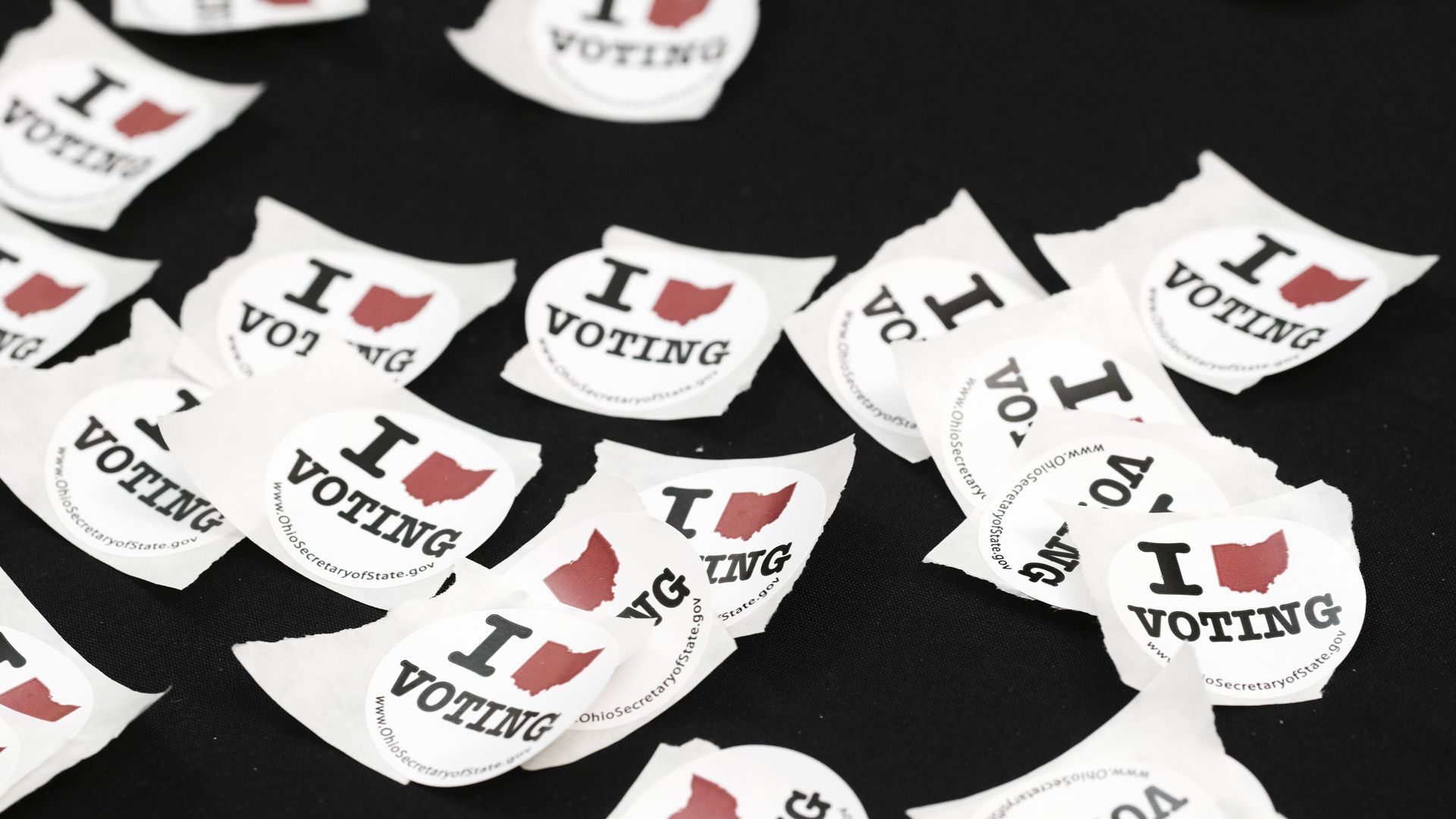 "I Voted" stickers scattered on a table.