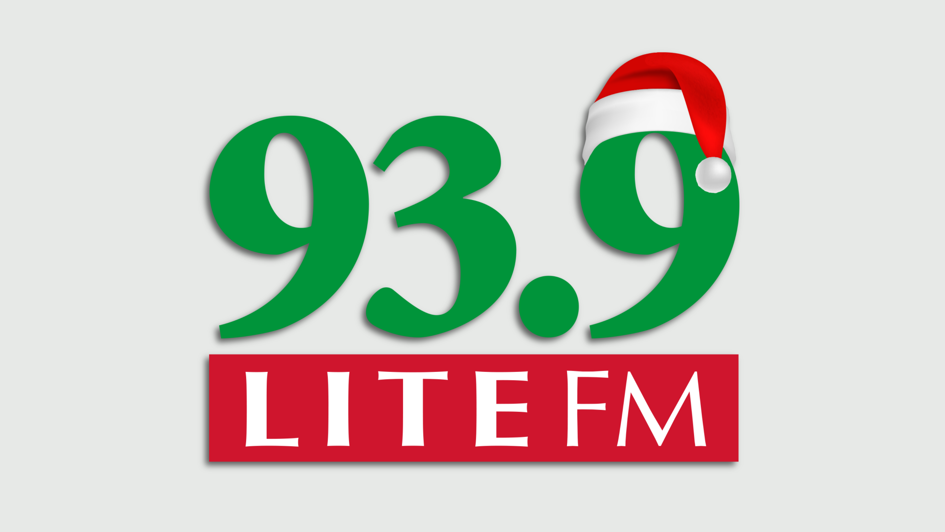 The 93.9 LITE FM logo with a Santa hat on the second 9.