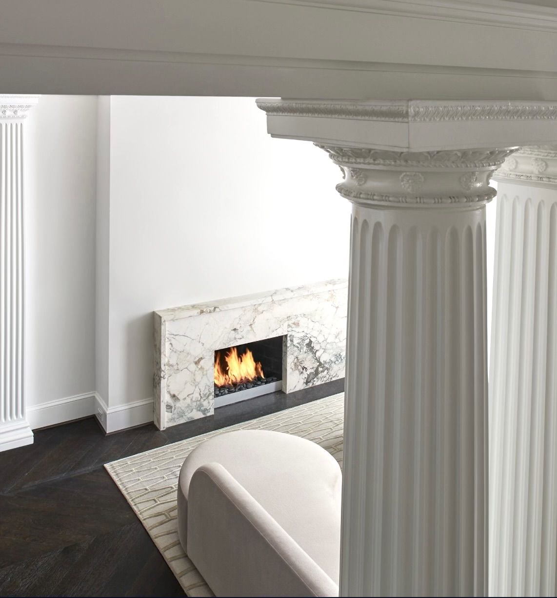 A photo of a living room with a fireplace.