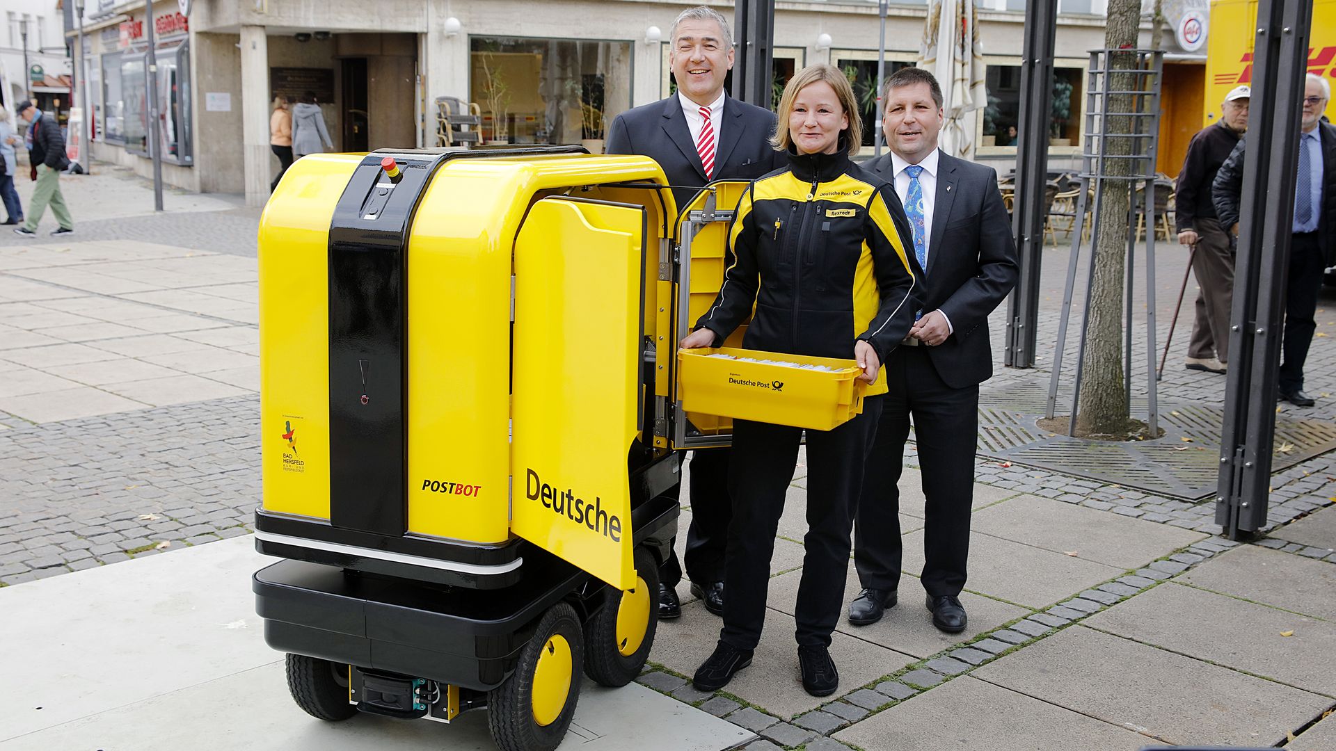Photo of DHL's roving mailbox and mail carrier in Germany