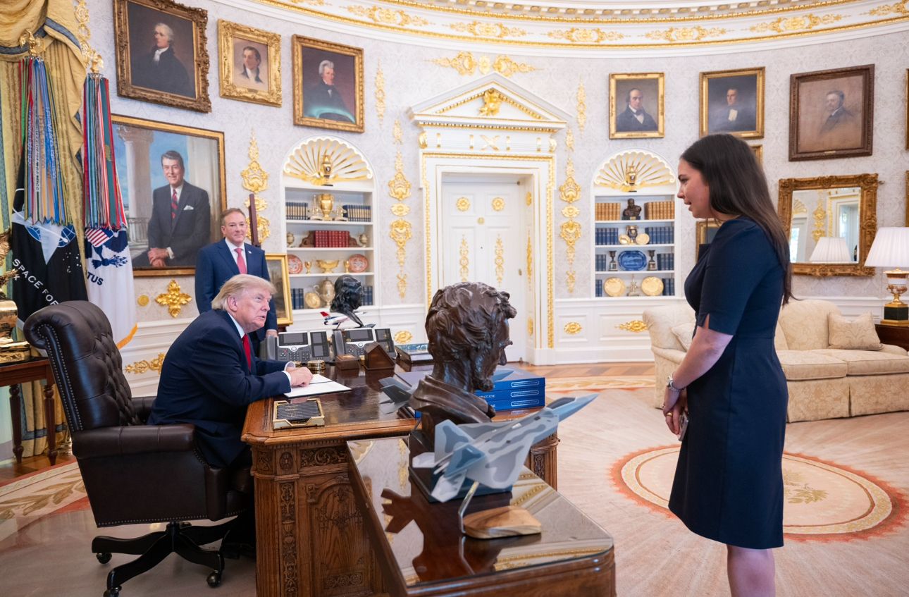 Abigail Jackson talks with President Trump in the Oval Office.