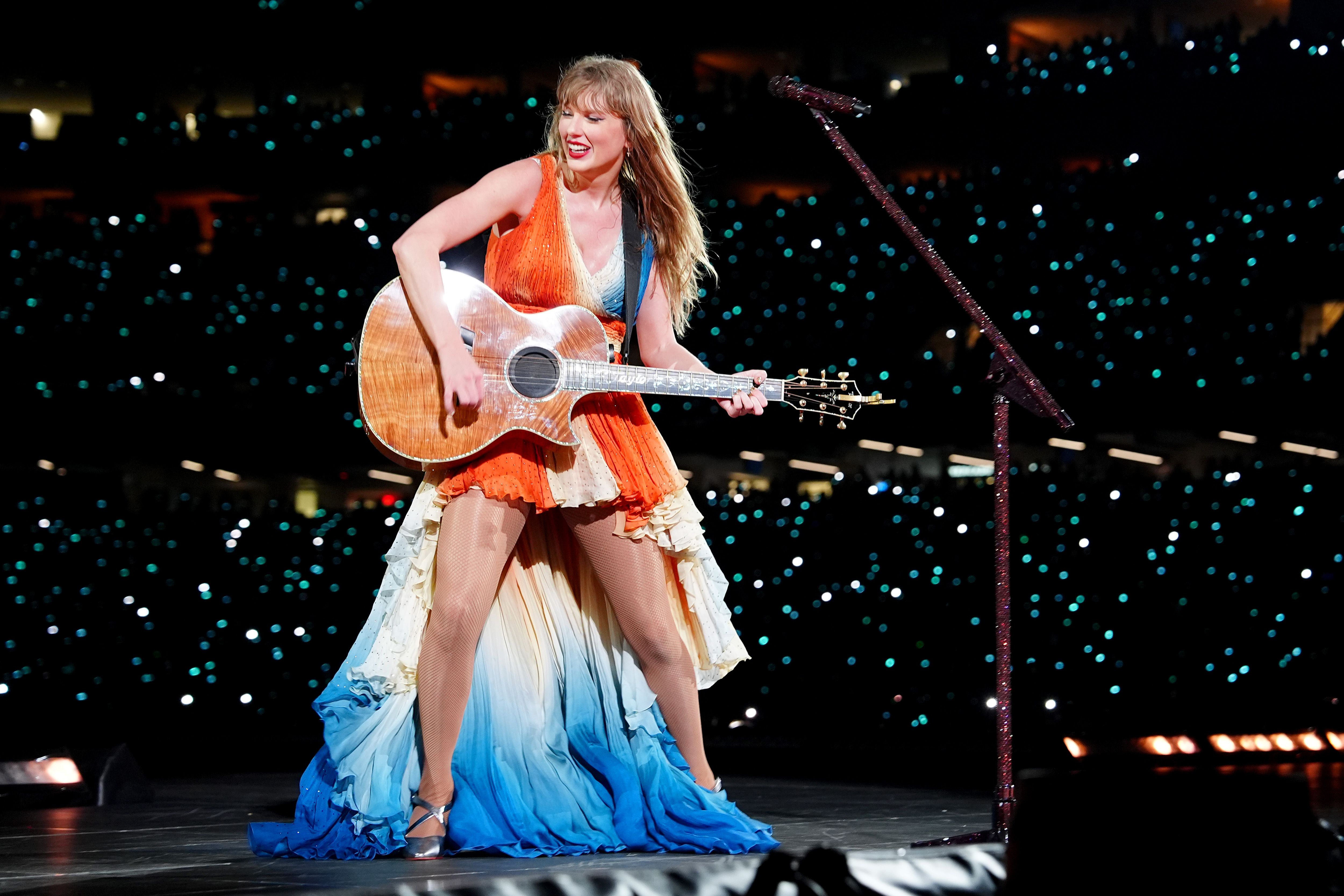 Photo shows Taylor Swift in her new koi dress.