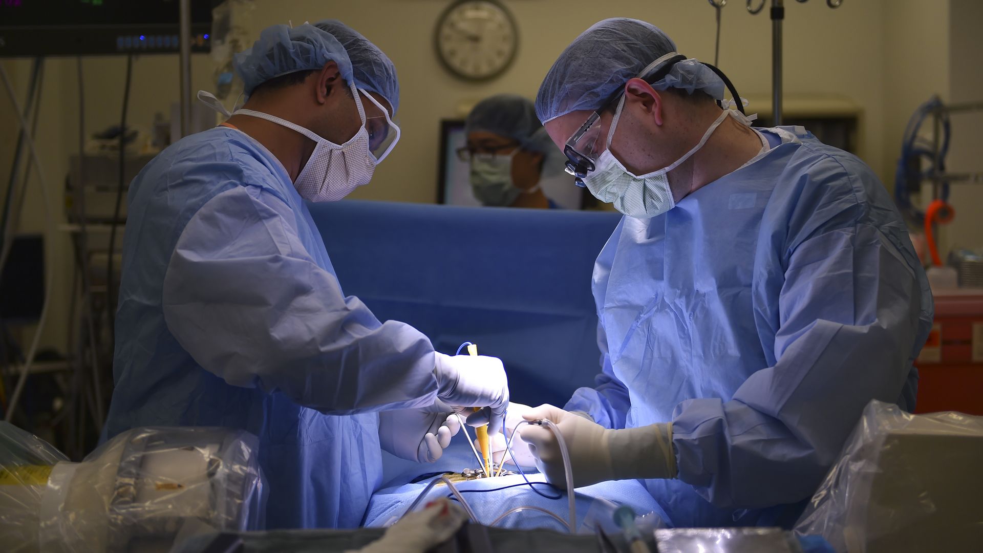 two doctors operating