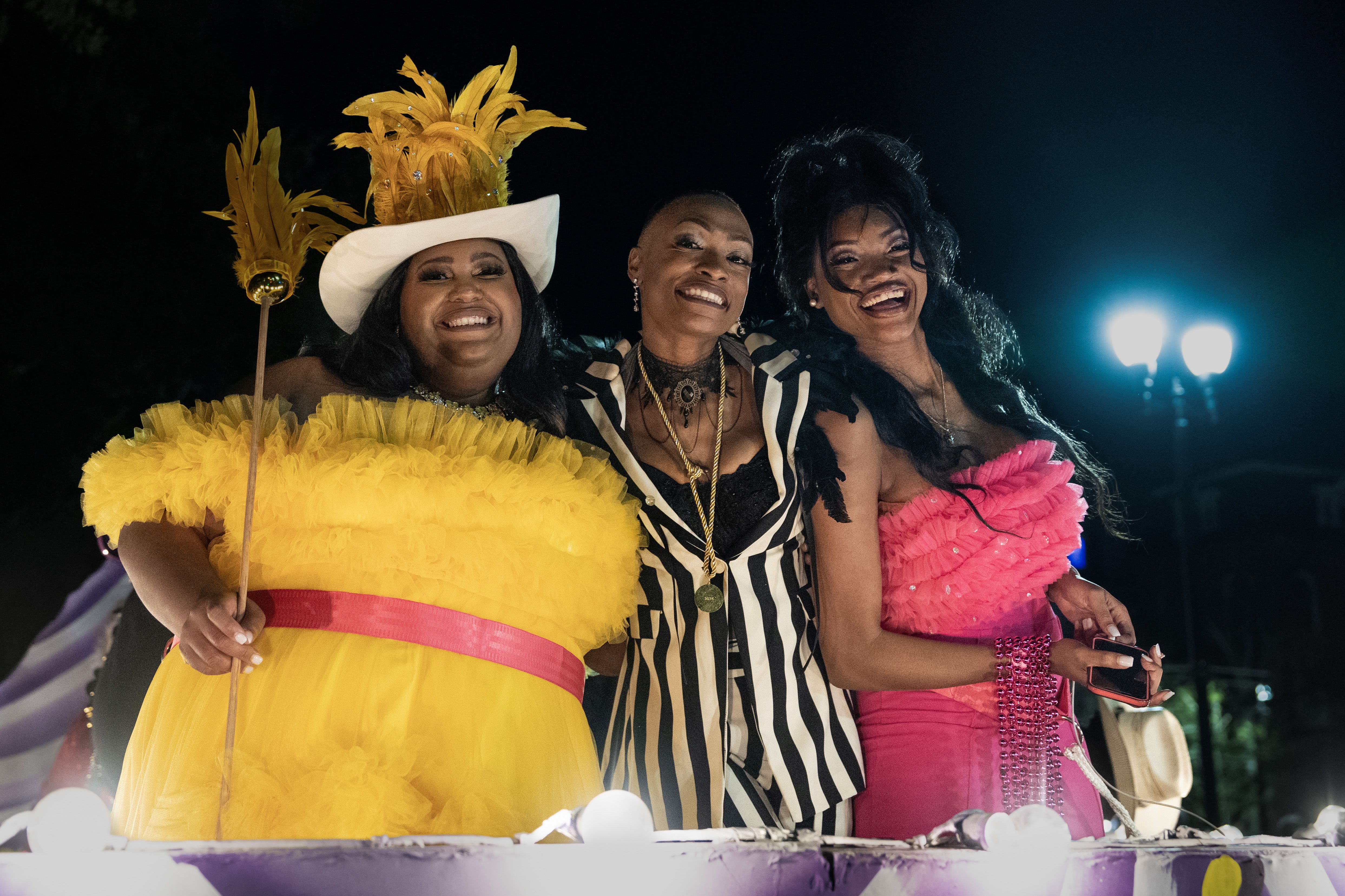 Danica Hart, Trae Swindle and Devynn Hart of the band Chapel Hart are show on Krewe of Nyx parade float.