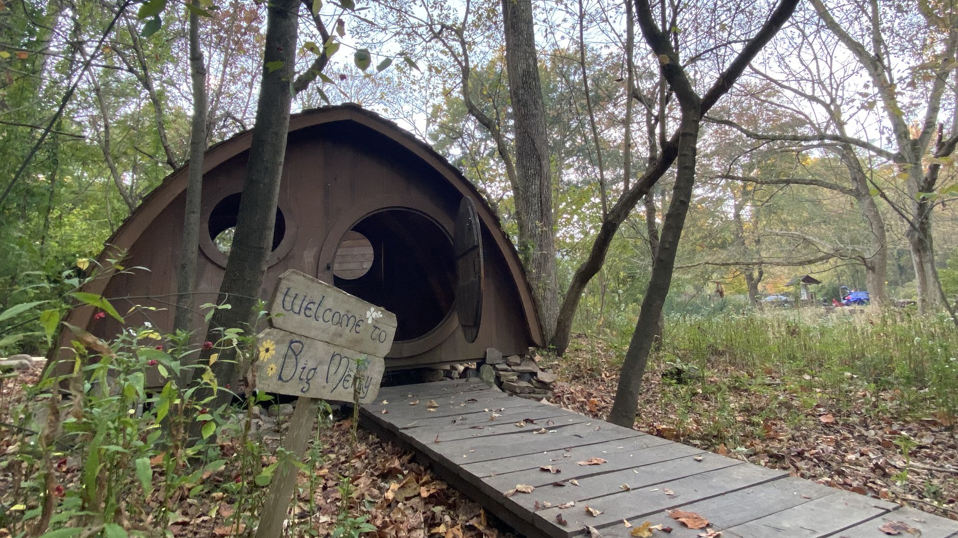 A photo of a small wooden structure that resembles the homes where hobbits live in the fantasy series