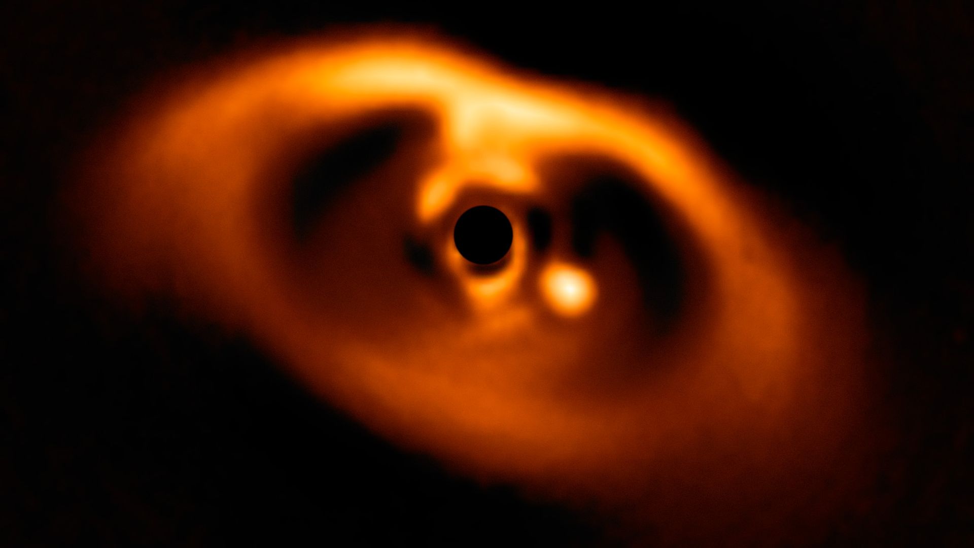 the first clear image of a planet caught in the very act of formation around the dwarf star PDS 70.