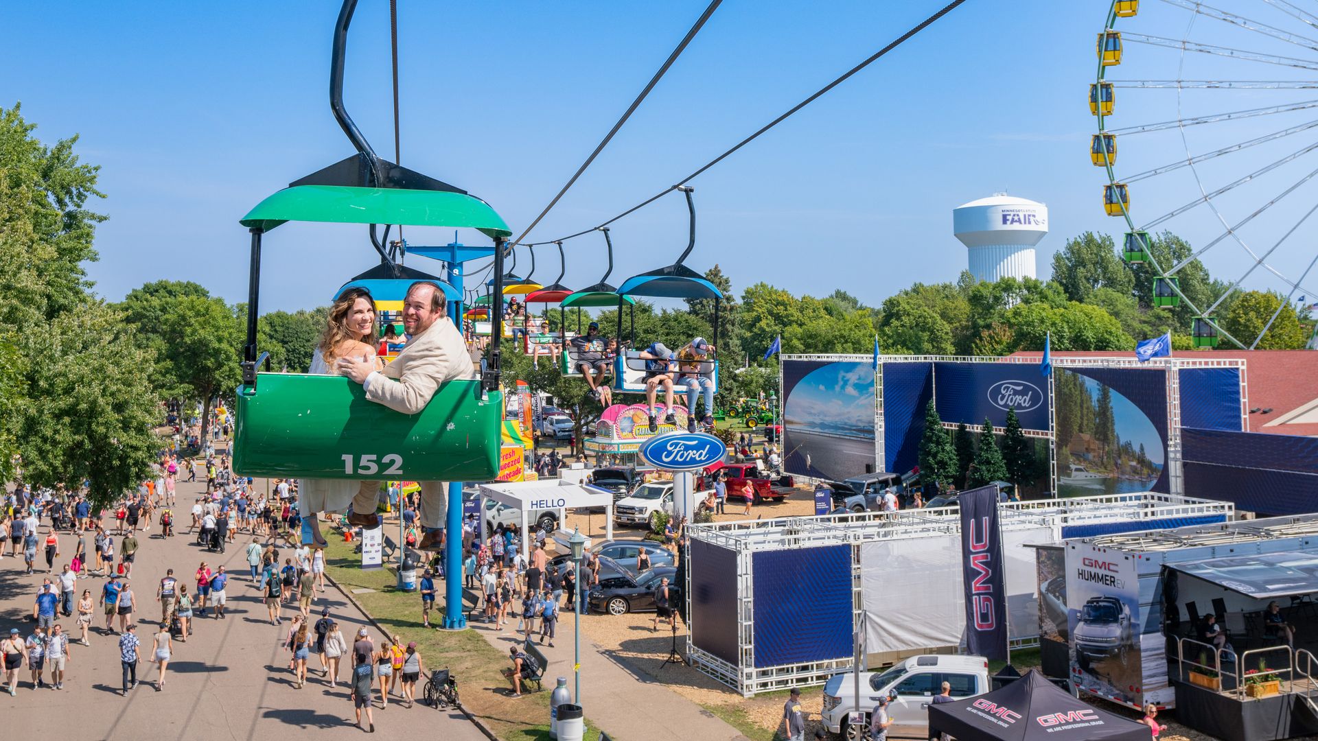 Two people on a sky glider at the state fair