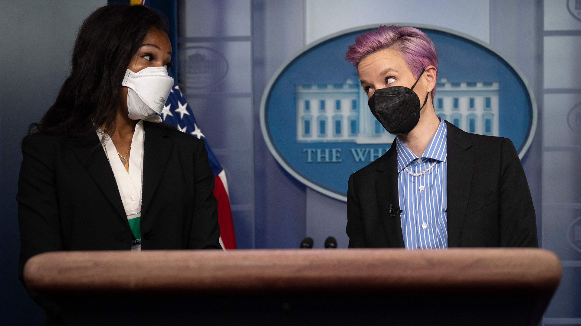 U.S. Women's National Soccer Team members Margaret Purce and Megan Rapinoe appear in the Briefing Room before an Equal Pay Day event at the White House.