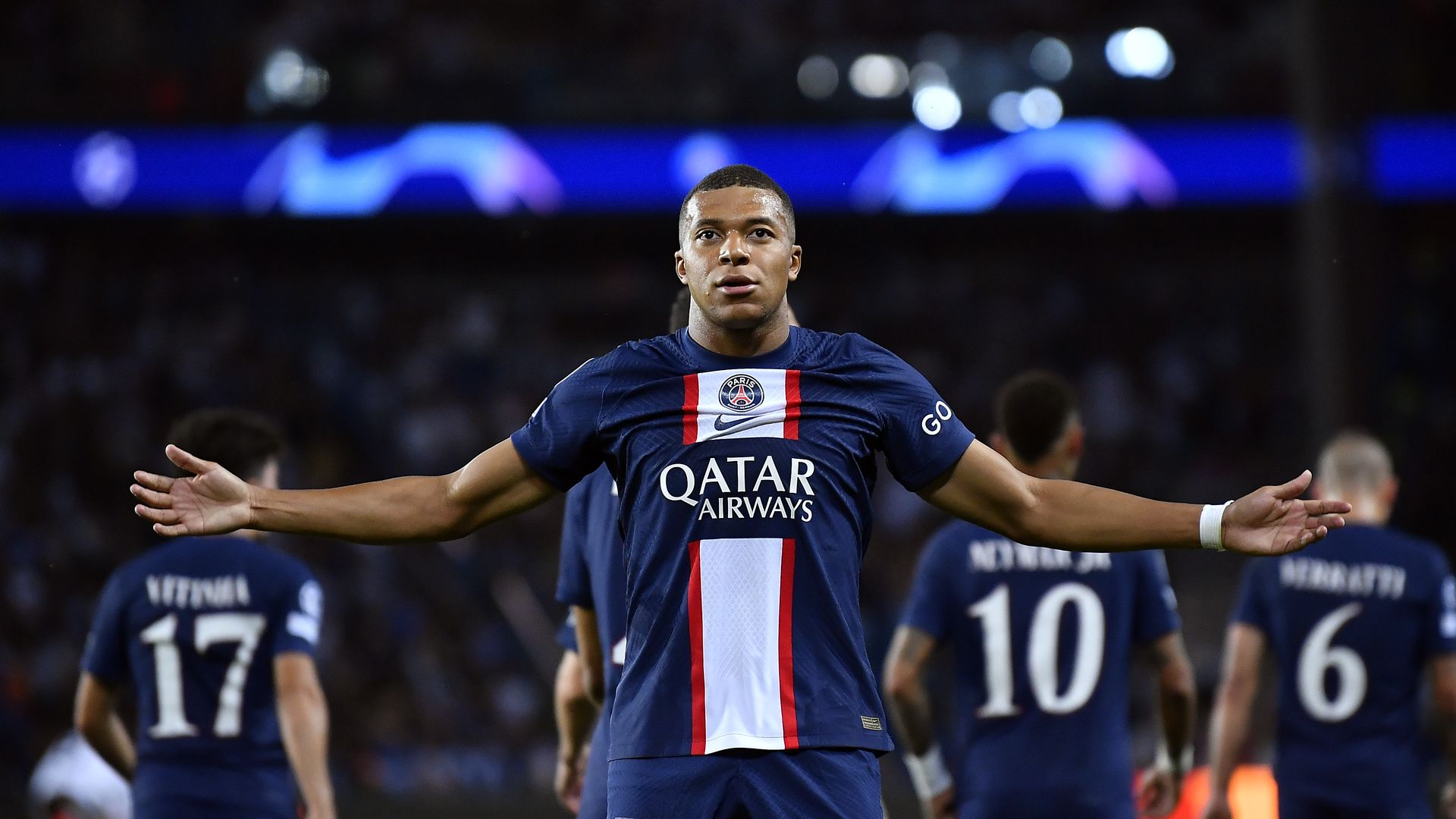 kylian mbappe arms outstretched