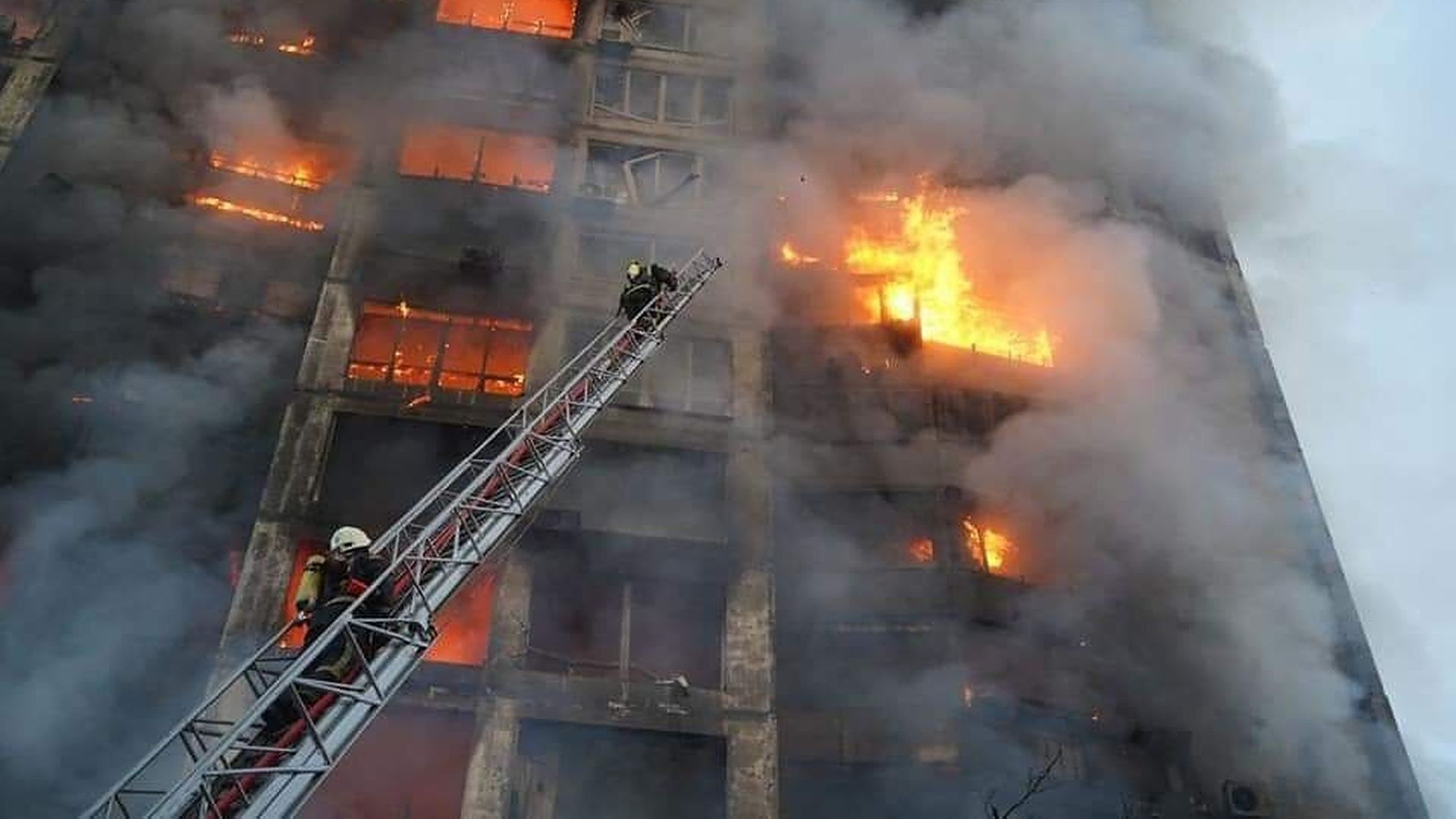 Firefighters try to extinguish a fire after a residential building hit by a Russian attack in Kyiv, Ukraine on March 15.