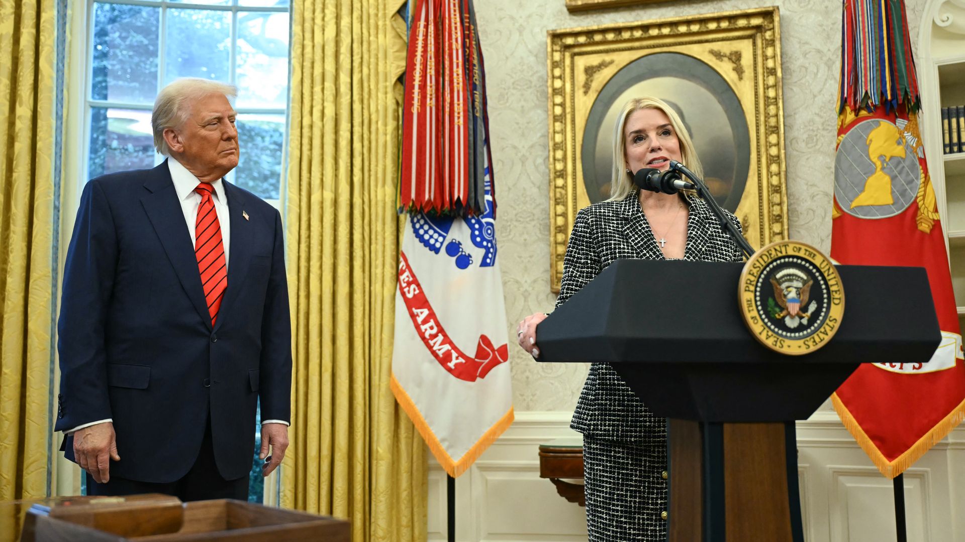 President Donald Trump listens to Pam Bondi after she was sworn in as US Attorney General in the Oval Office of the White House in Washington, DC, on February 5, 2025. 
