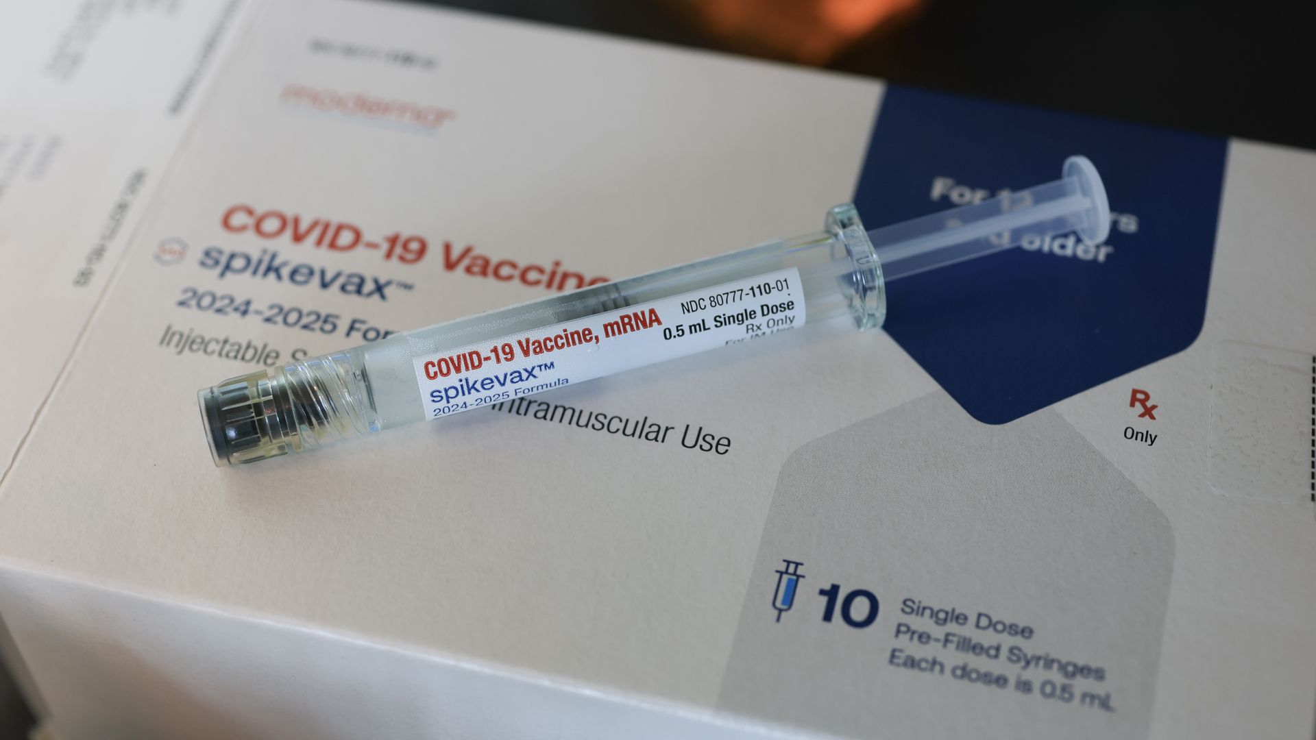 n this photo illustration, a Moderna COVID-19 vaccine fills a syringe.