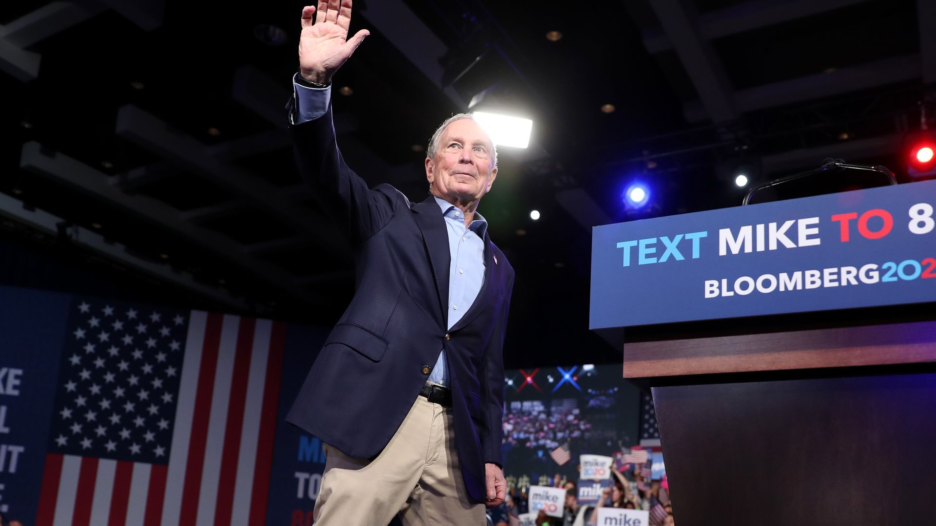 Mike Bloomberg waves to supporters at a rally in Florida