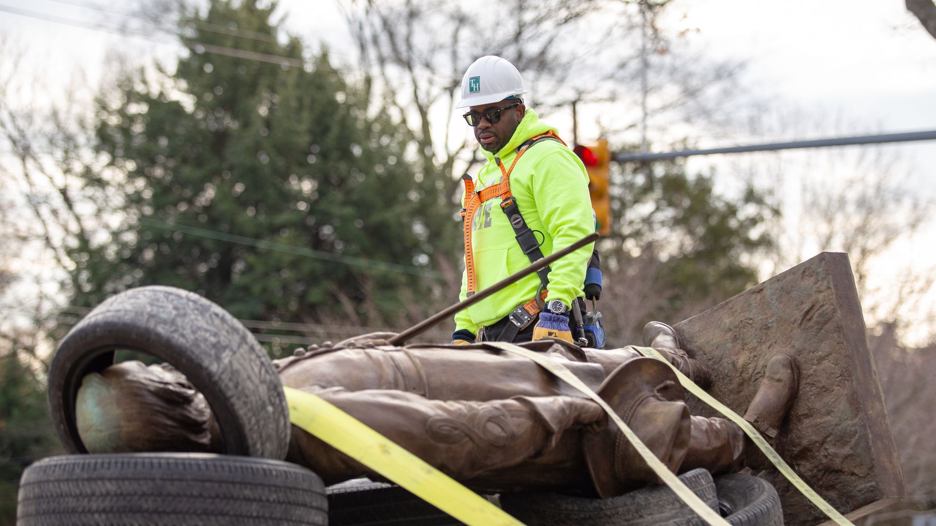 Devon Henry looks at a statue of Confederate Gen. A.P. Hill after it was removed from its pedestal in Richmond, Va., December 12, 2022.