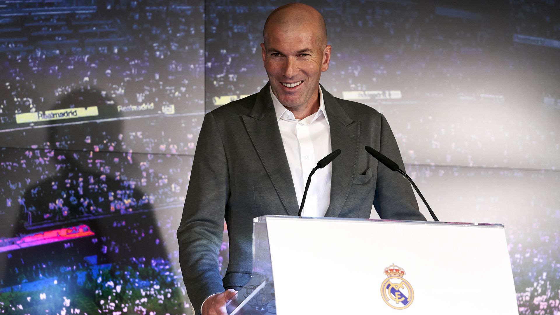 Zinedine Zidane standing at a podium