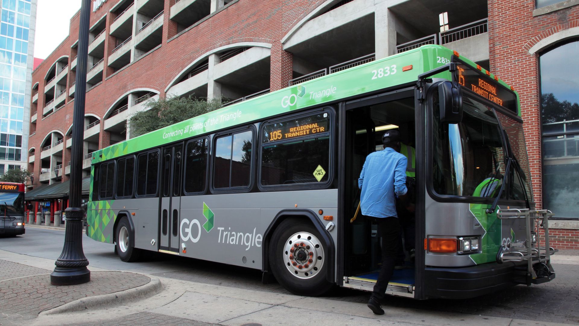 A man boards a GoTriangle bus in downtown Raleigh