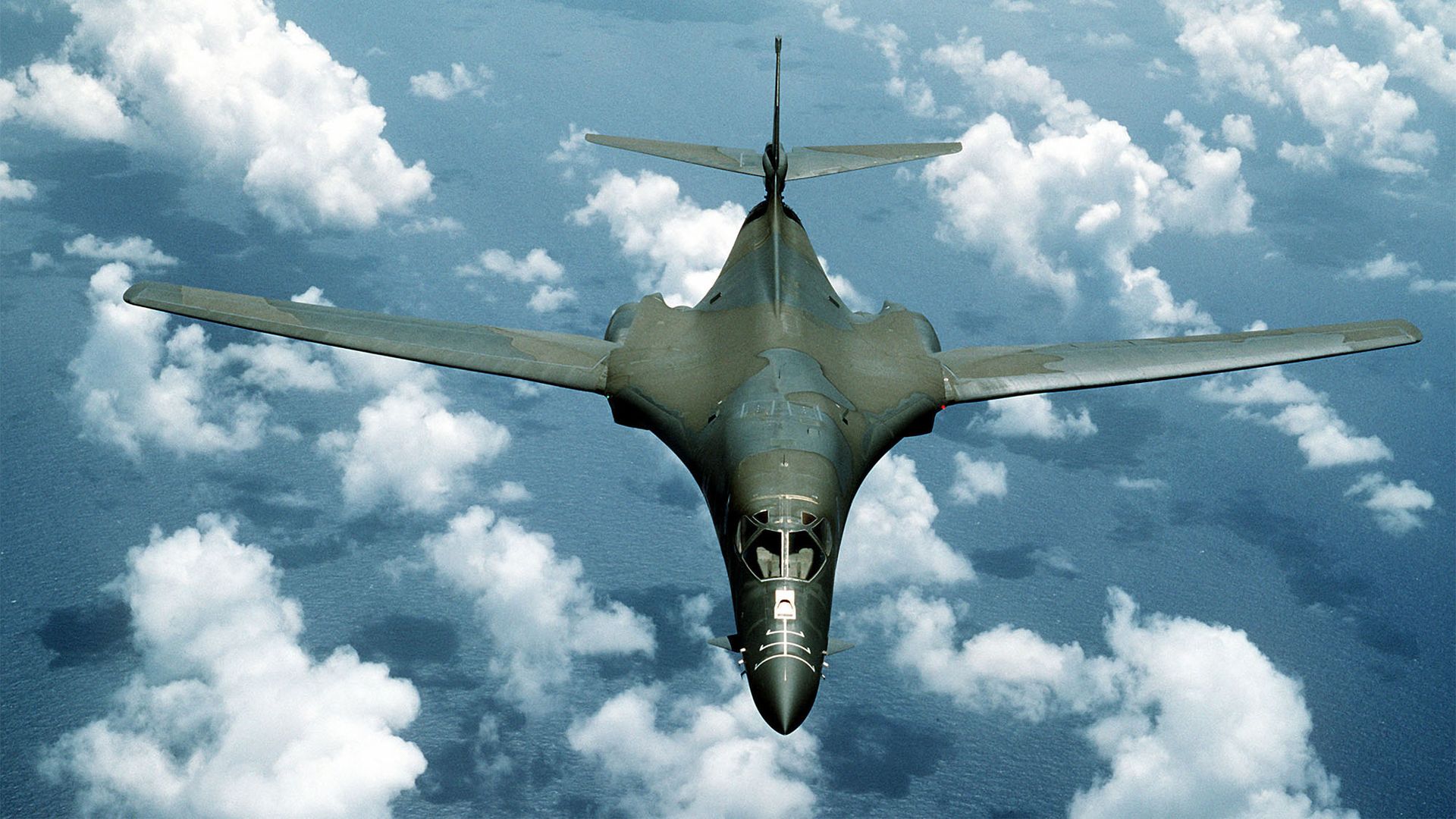 FILE PHOTO: A B-1B aircraft passes over the ocean while on a flight out of Anderson Air Force Base, Guam, during Exercise Giant Warrior ''89.