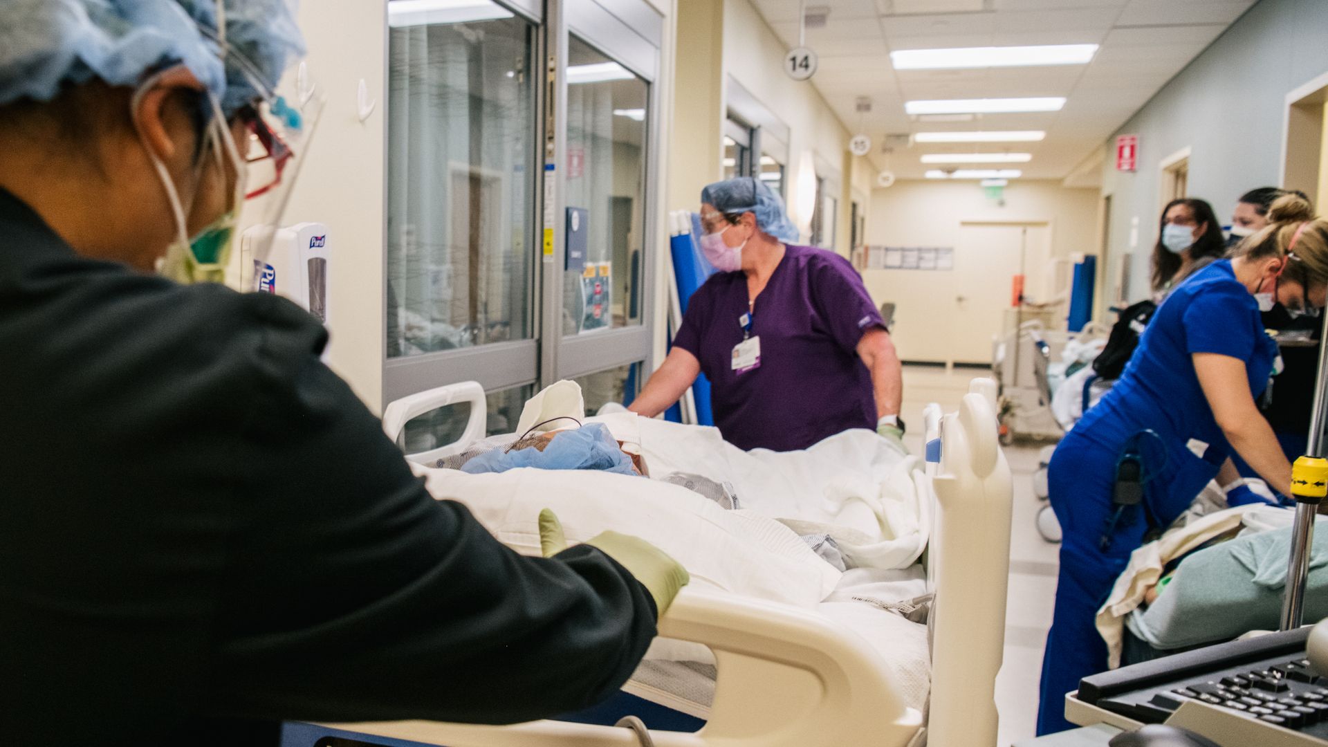 Emergency Room nurses tend to patients in a hallway at the Houston Methodist The Woodlands Hospital on August 18, 2021 in Houston, Texas.