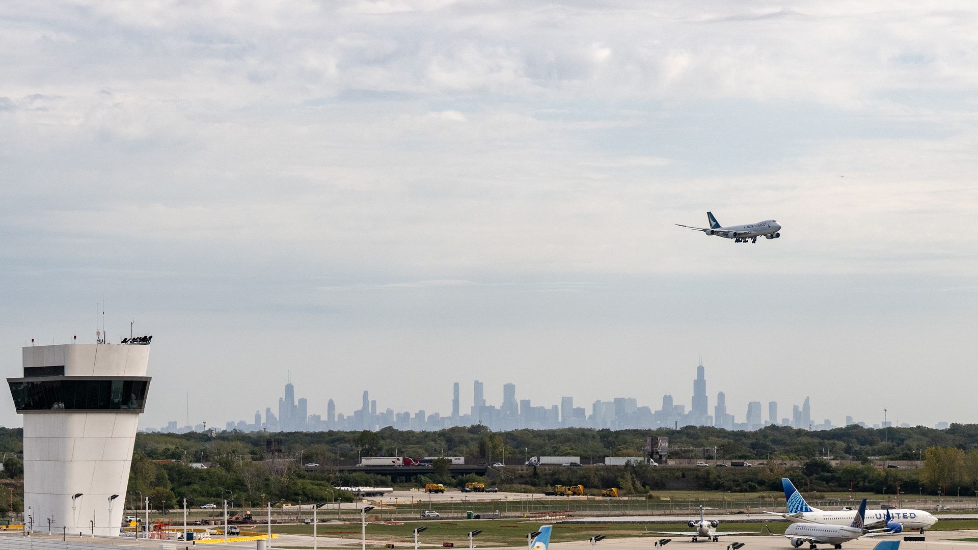 Photo of a plane approaching an airport for a landing. 