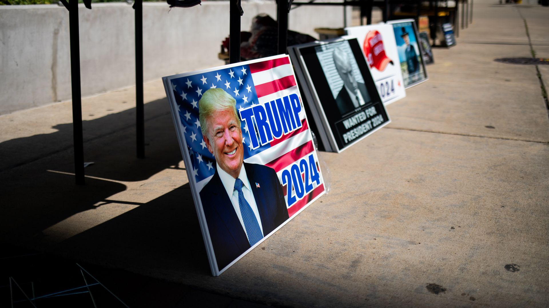 Signs supporting former US President Donald Trump displayed ahead of a campaign event at Van Andel Arena in Grand Rapids, Michigan, US, on Saturday, July 20, 2024. 