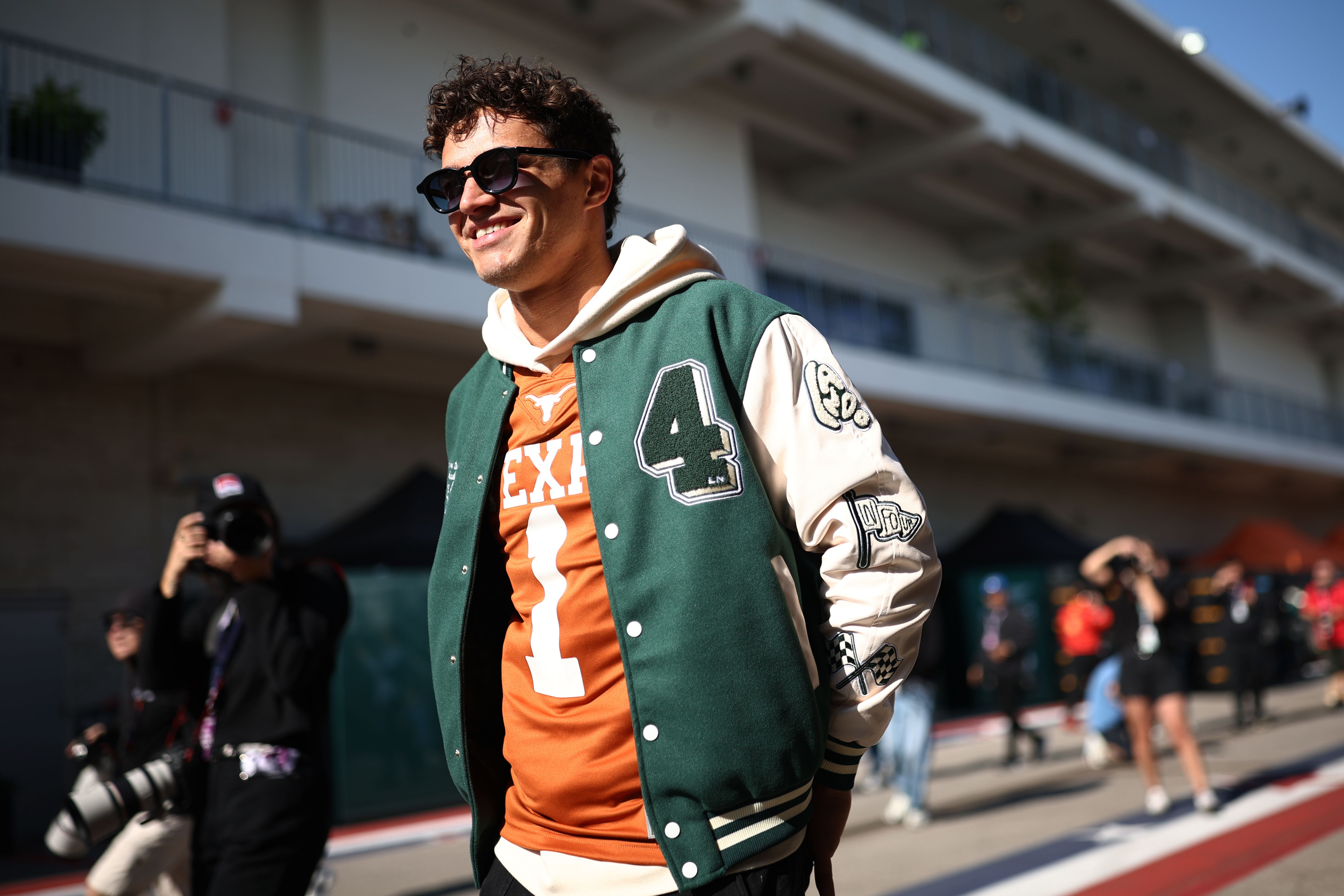 Sporting a Longhorns jersey, Lando Norris of Great Britain and McLaren makes a track appearance.