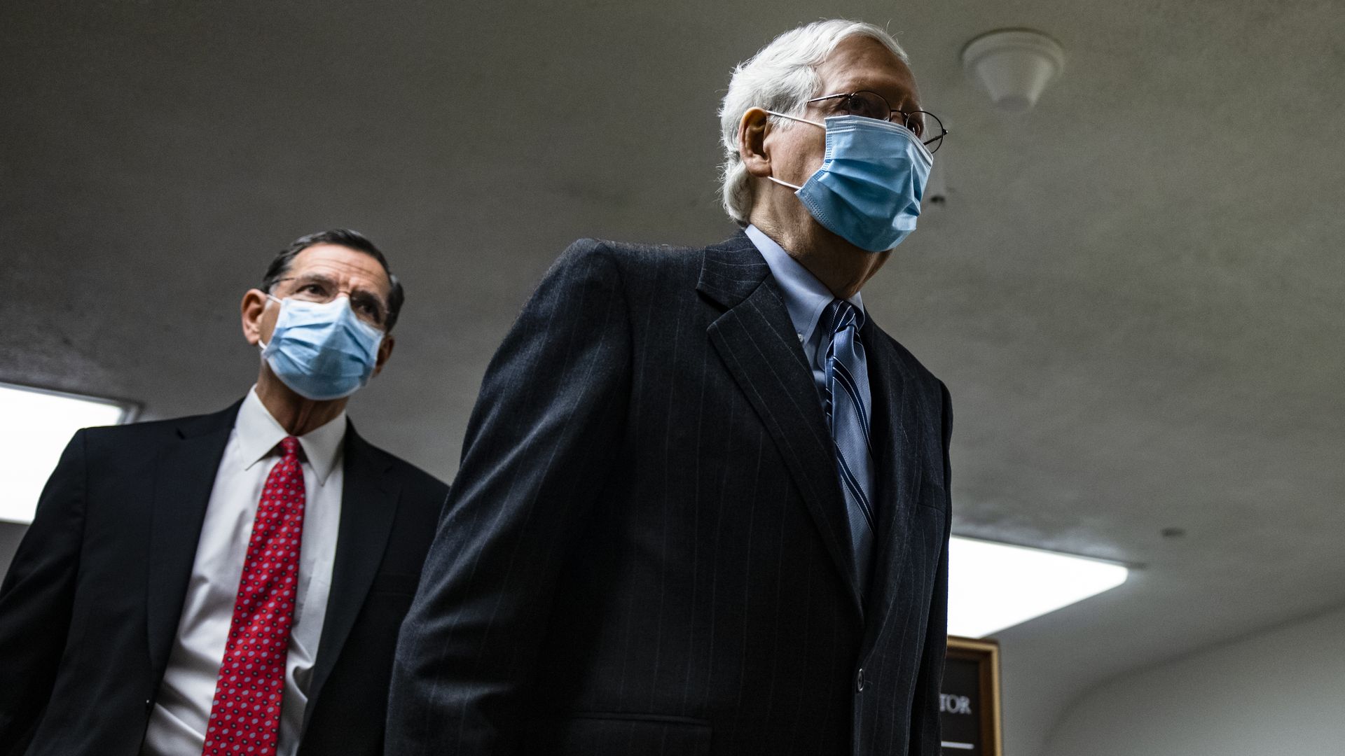 Senate Minority Leader Mitch McConnell walking through the Capitol on Feb. 12.