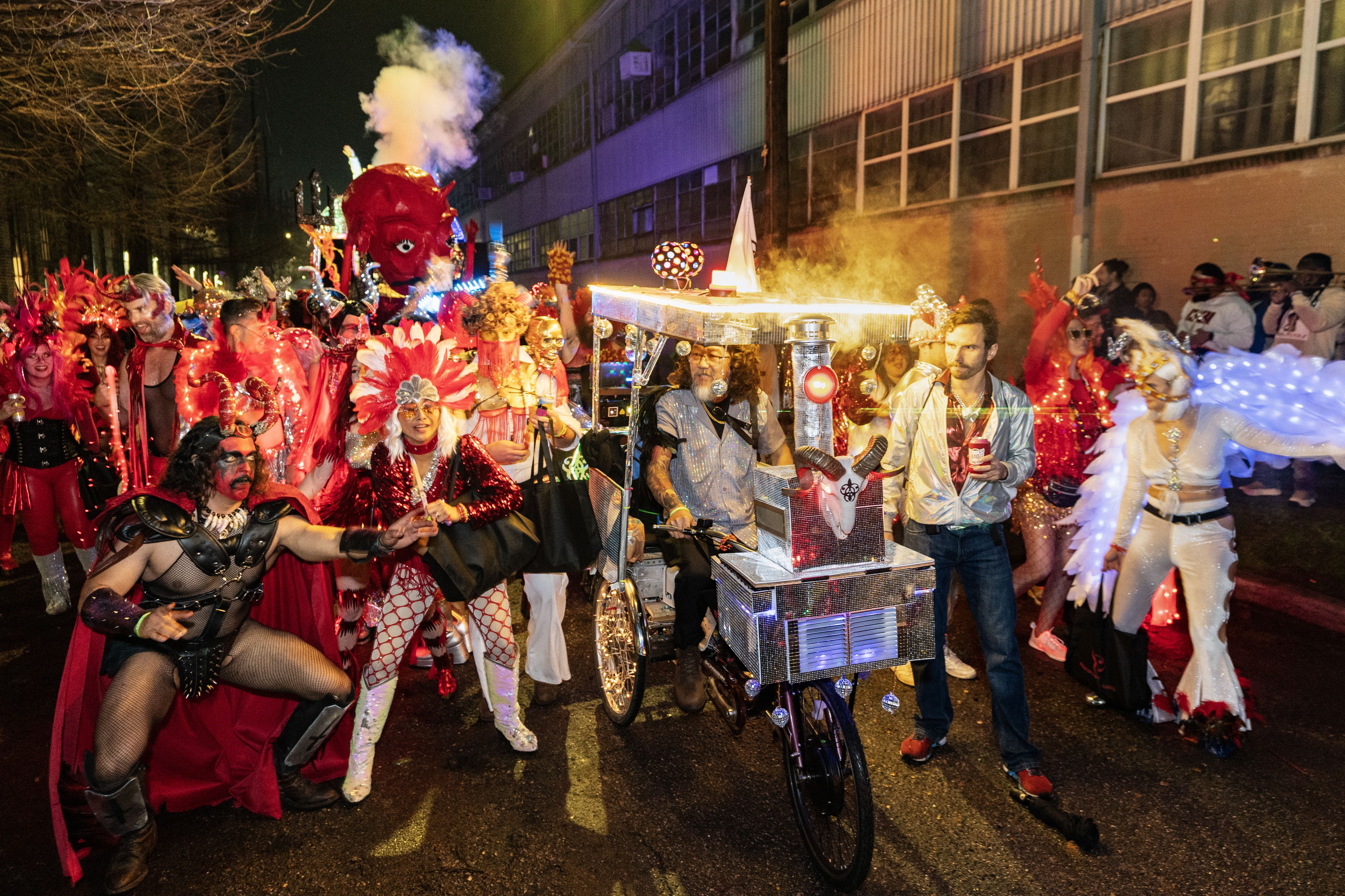 Photo shows people parading with Krewe Boheme
