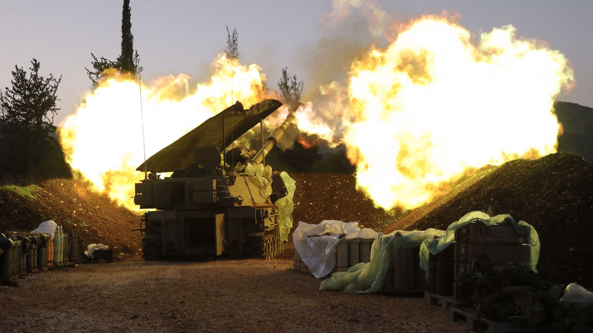  An Israeli artillery unit fires from a position in Upper Galilee in northern Israel towards southern Lebanon