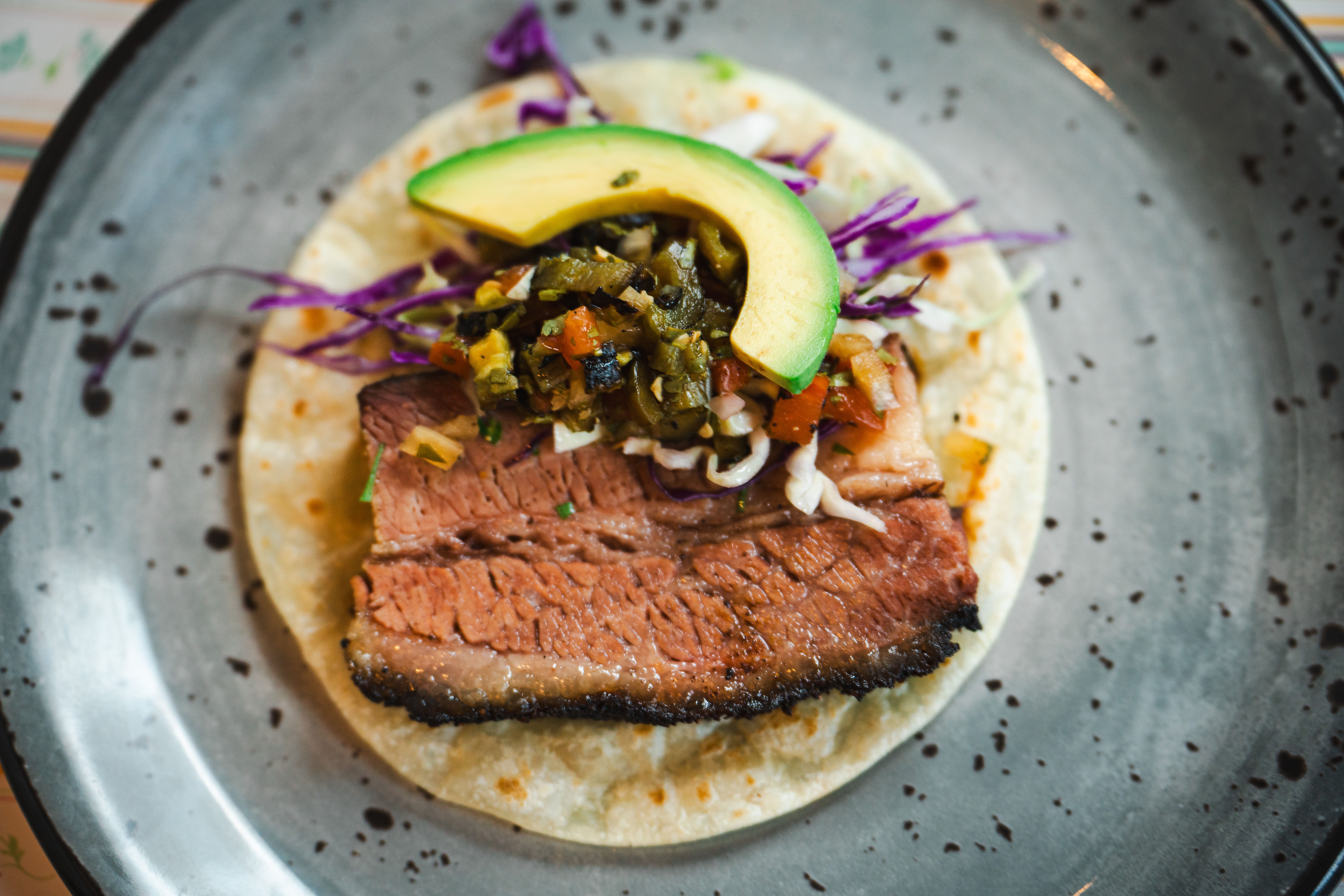 A taco with brisket on it