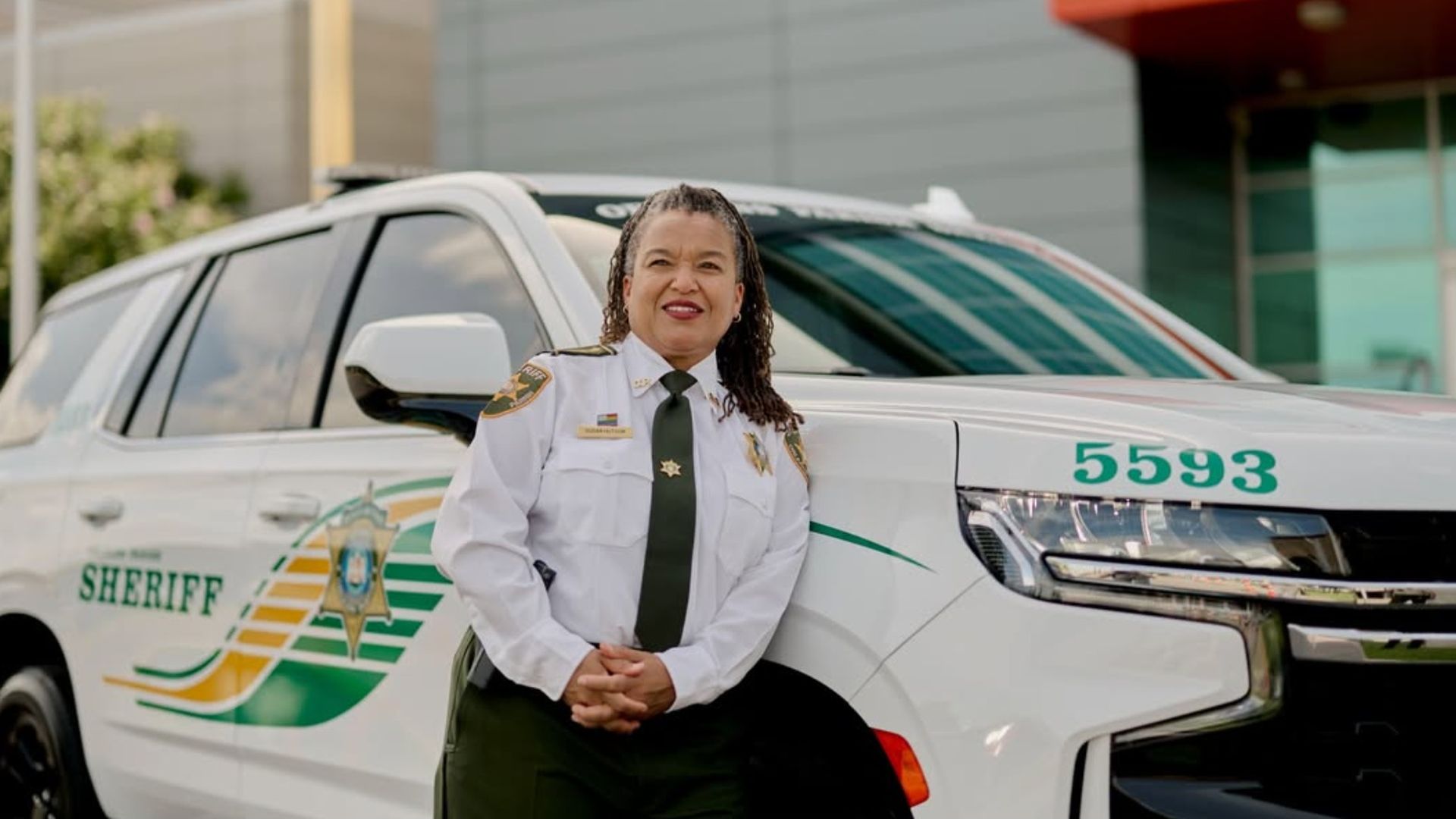 Orleans Parish Sheriff Susan Hutson leans against a Sheriff's Department vehicle.