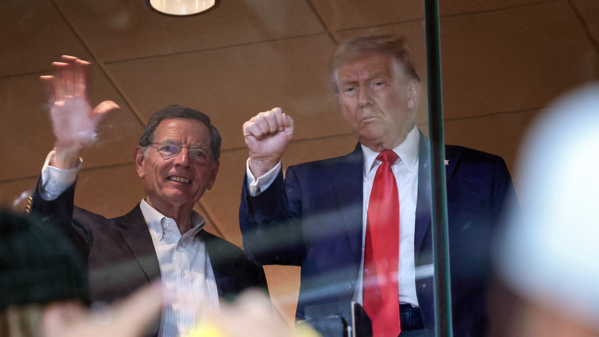 Republican presidential nominee, former U.S. President Donald Trump, joined by U.S. Sen. John Barrasso (R-WY), attends the Pittsburgh Steelers game 