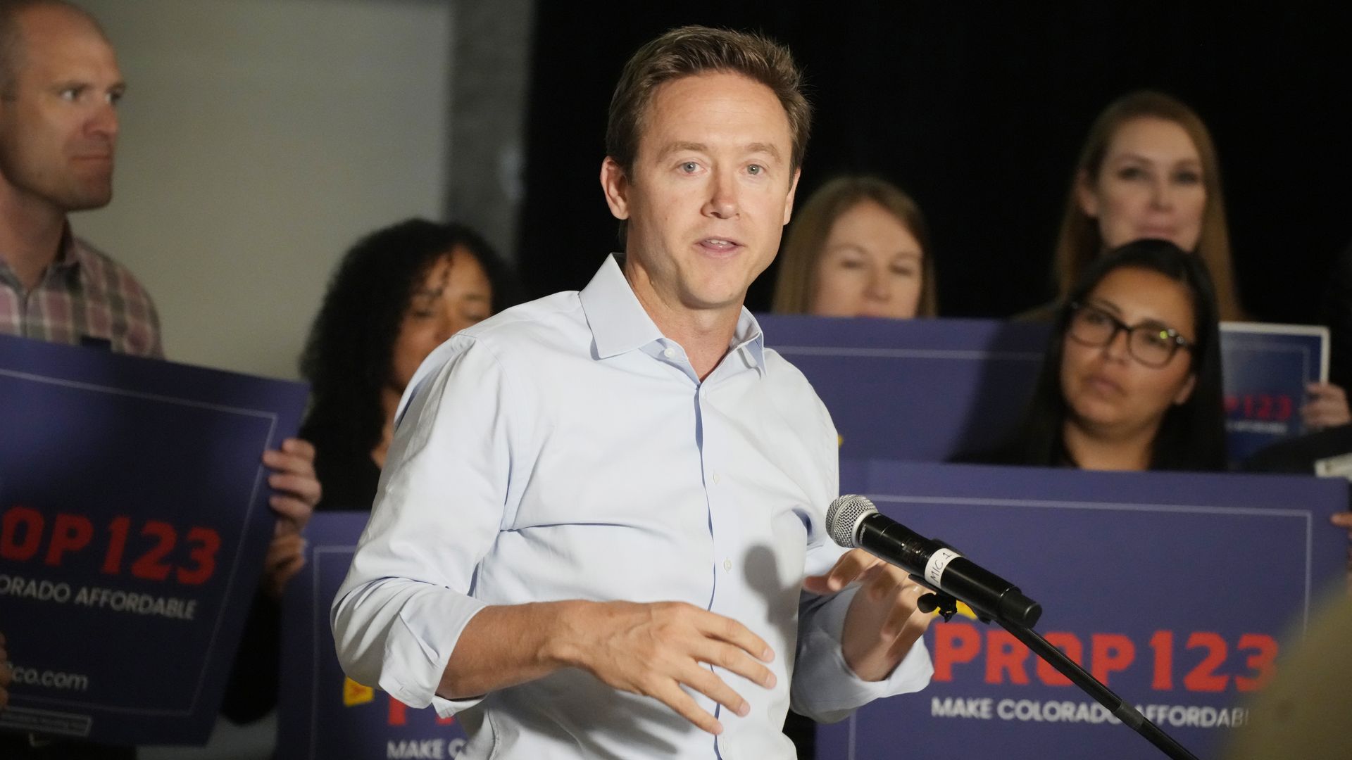 Mike Johnston campaigns for a ballot measure in September 2022. Photo: David Zalubowski/AP