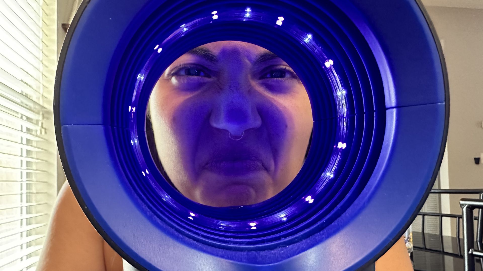 Selene's face inside a UV fly lamp