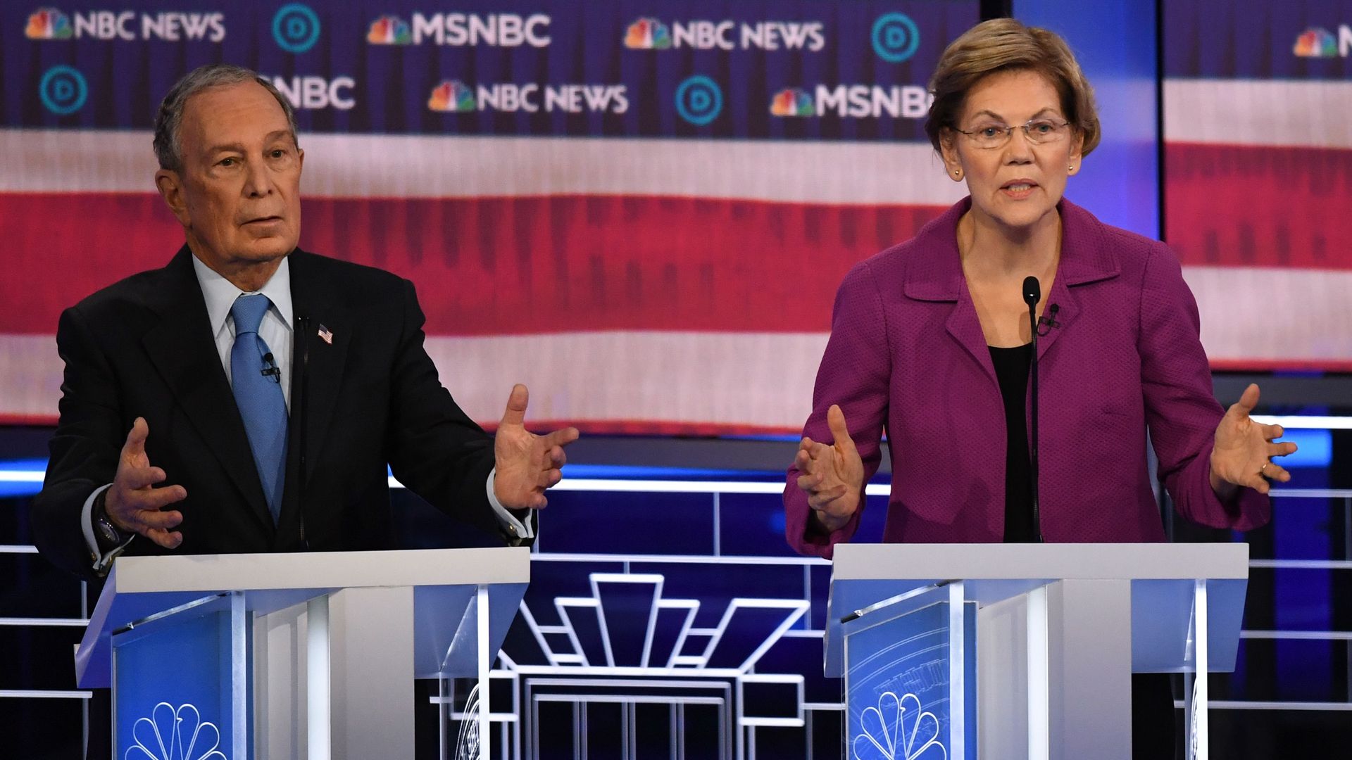 This image shows Elizabeth Warren standing next to Michael Bloomberg