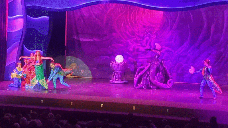 Ariel's fin costume is torn away to transform into legs in a stage performance of the Little Mermaid