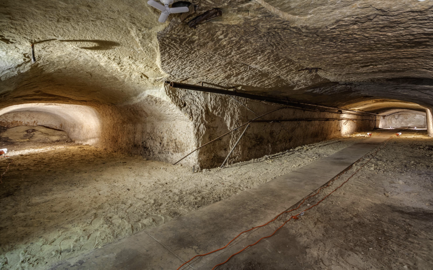 A cave with tunnels veering to the left and right 