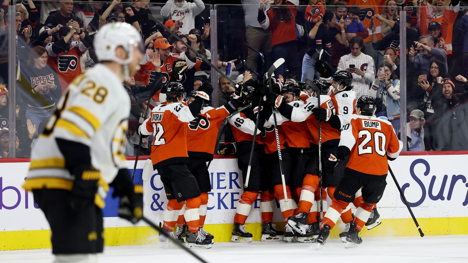 A group of Flyers players celebrate Porter Martone's overtime goal in Sunday's 2-1 win over the Bruins at Xfinity Mobile Arena.