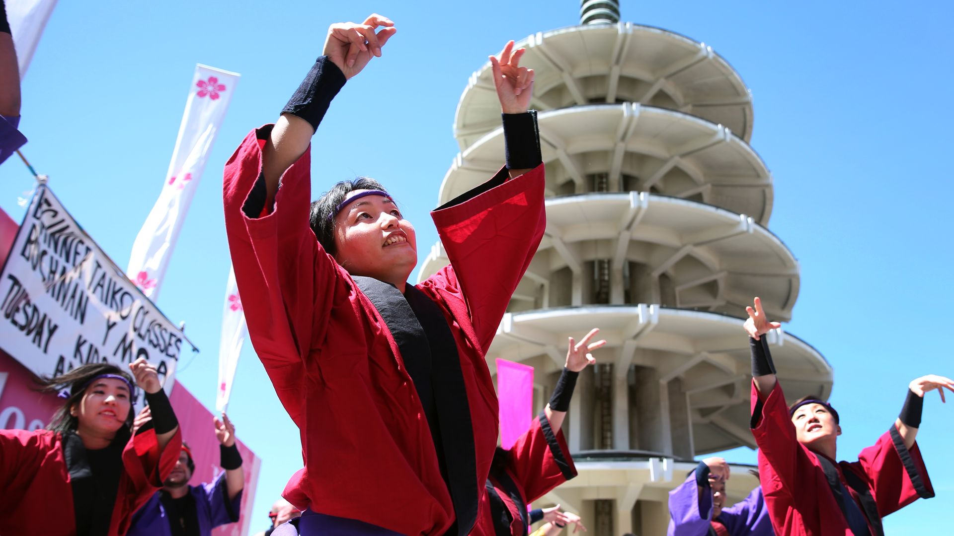 Photo of adolescents dancing while wearing traditional Japanese robes