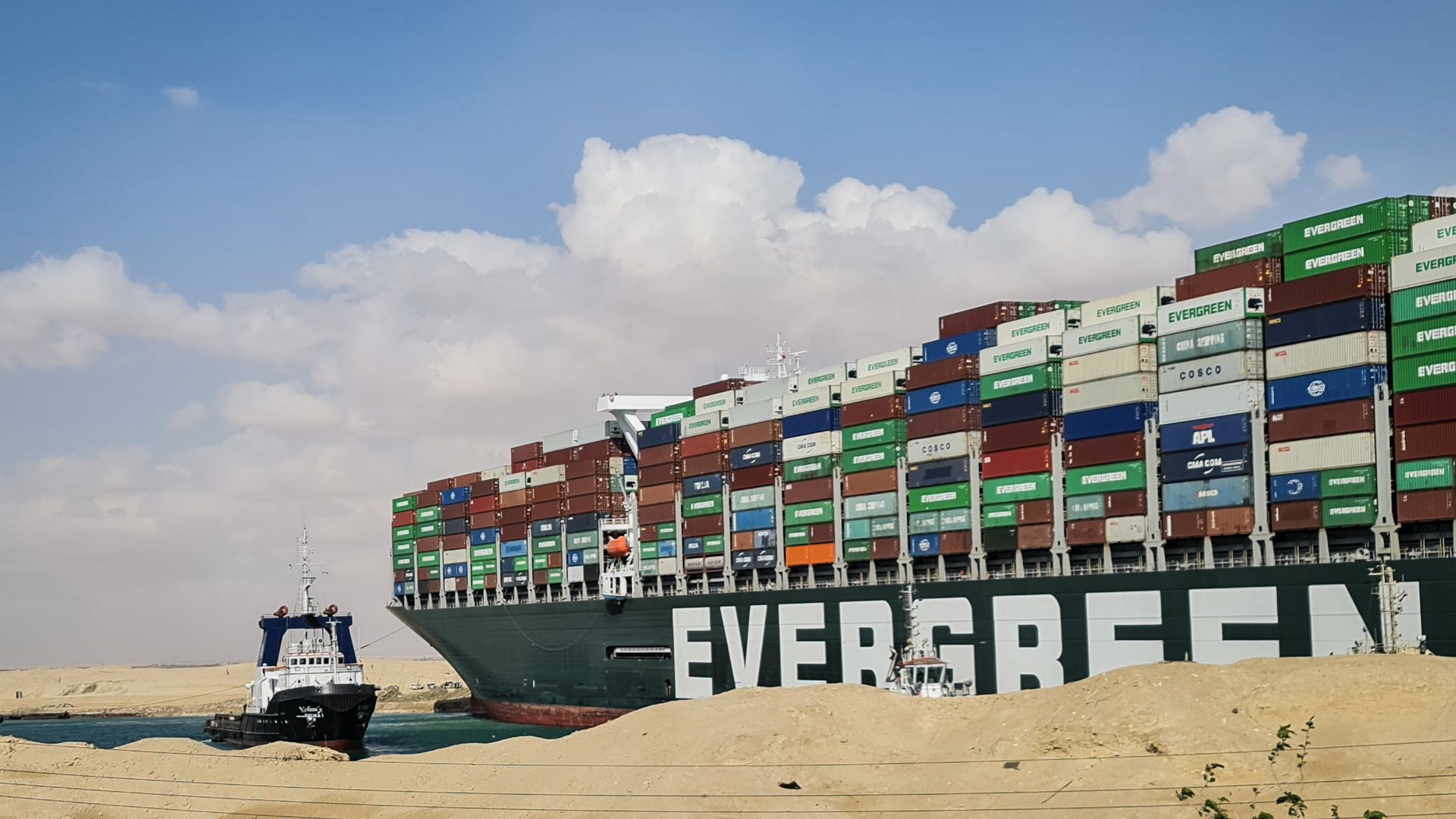 A tugboat attempting to refloat the "Ever Given" in the Suez Canal on March 26.