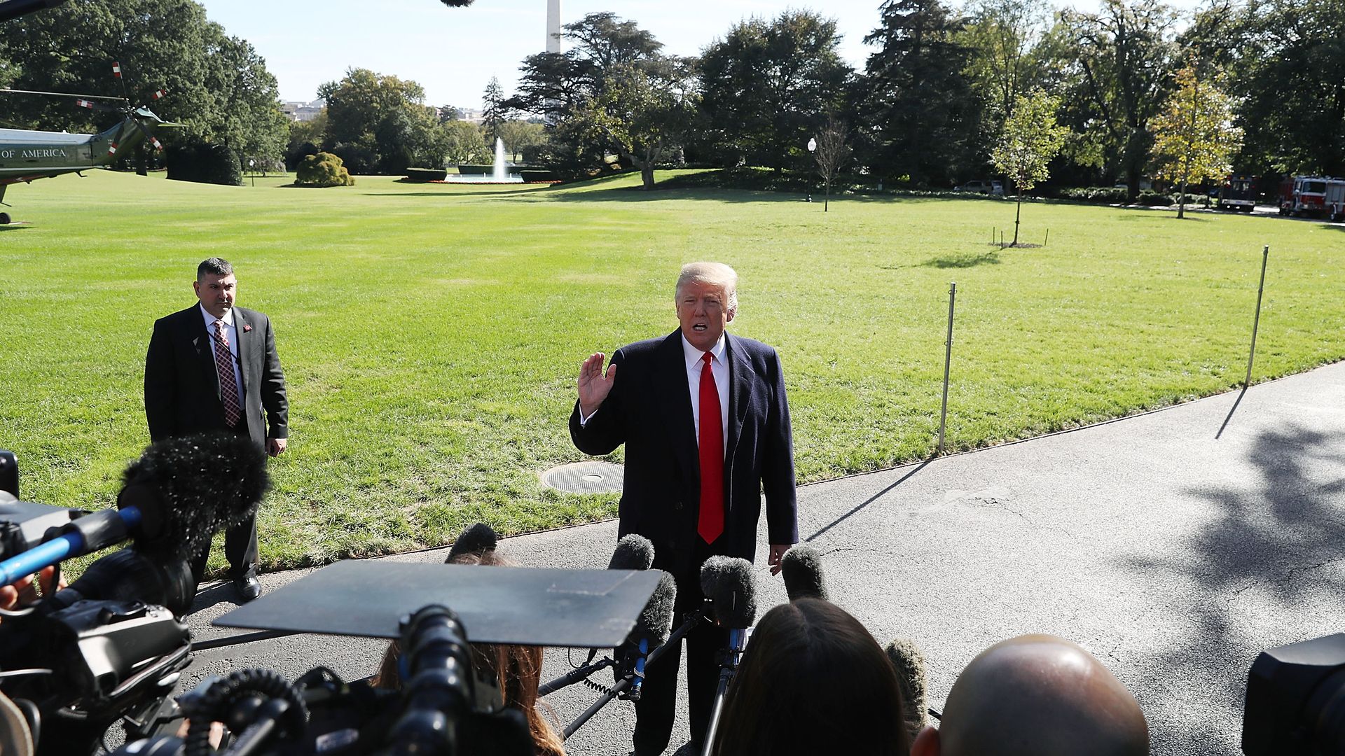 President Donald Trump speaks to the media before departing on Marine One to Houston, Texas to attend a Make America Great Again rally with Sen. Ted Cruz (R-TX).