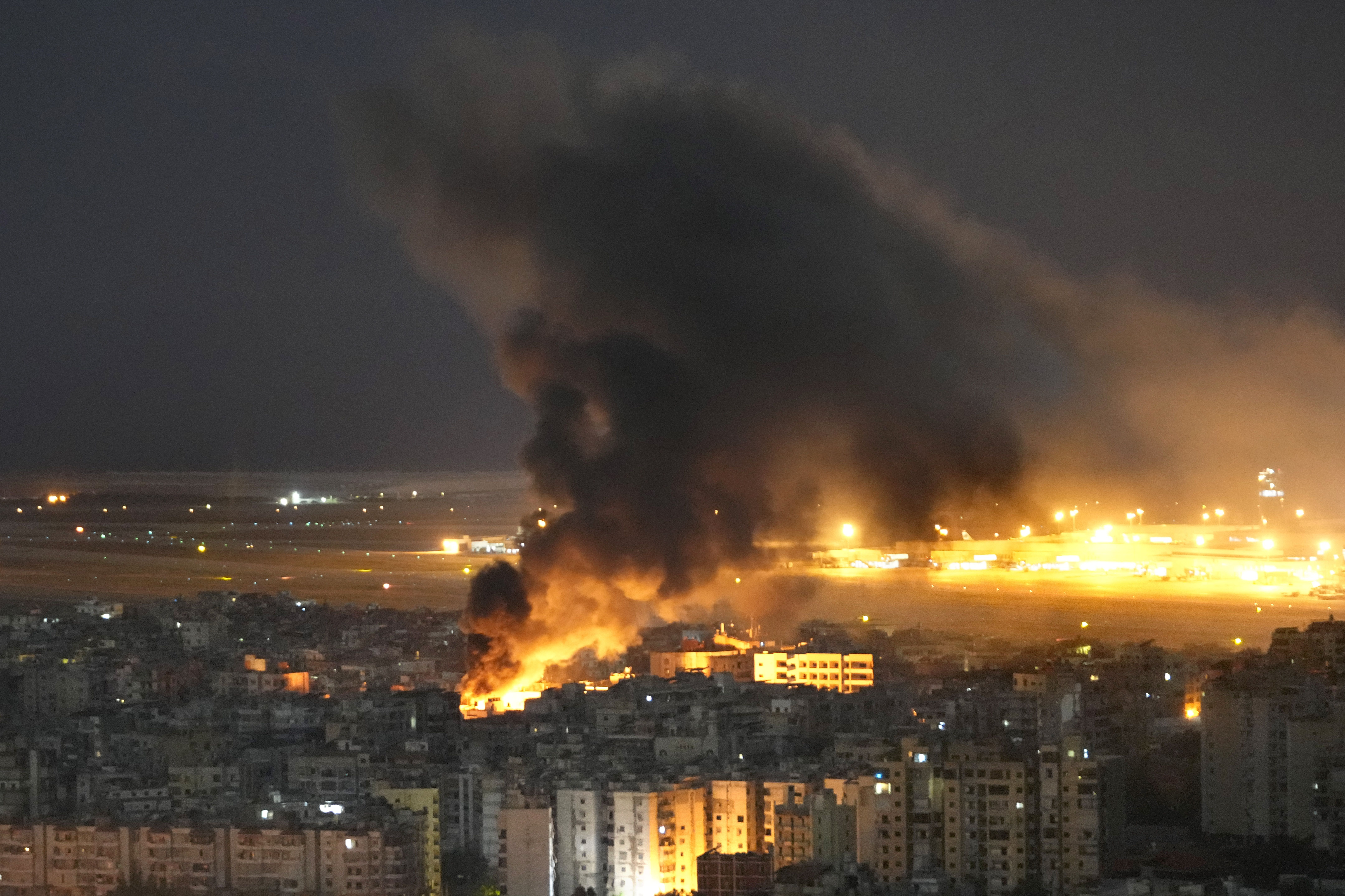 Flames and smoke rise form an Israeli airstrike on Dahiyeh, in the southern suburb of Beirut