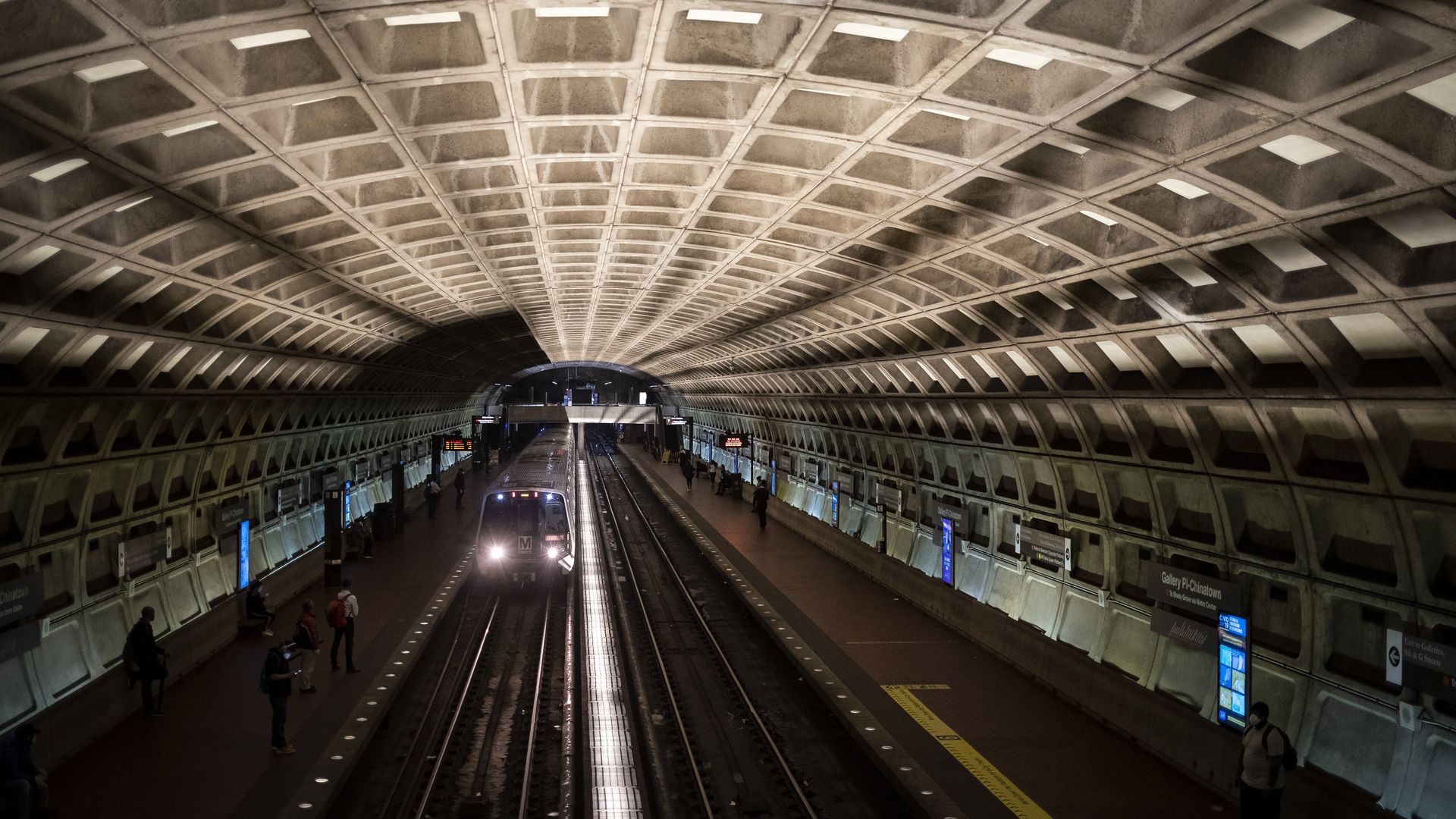 A Metro train pulls up into an underground station