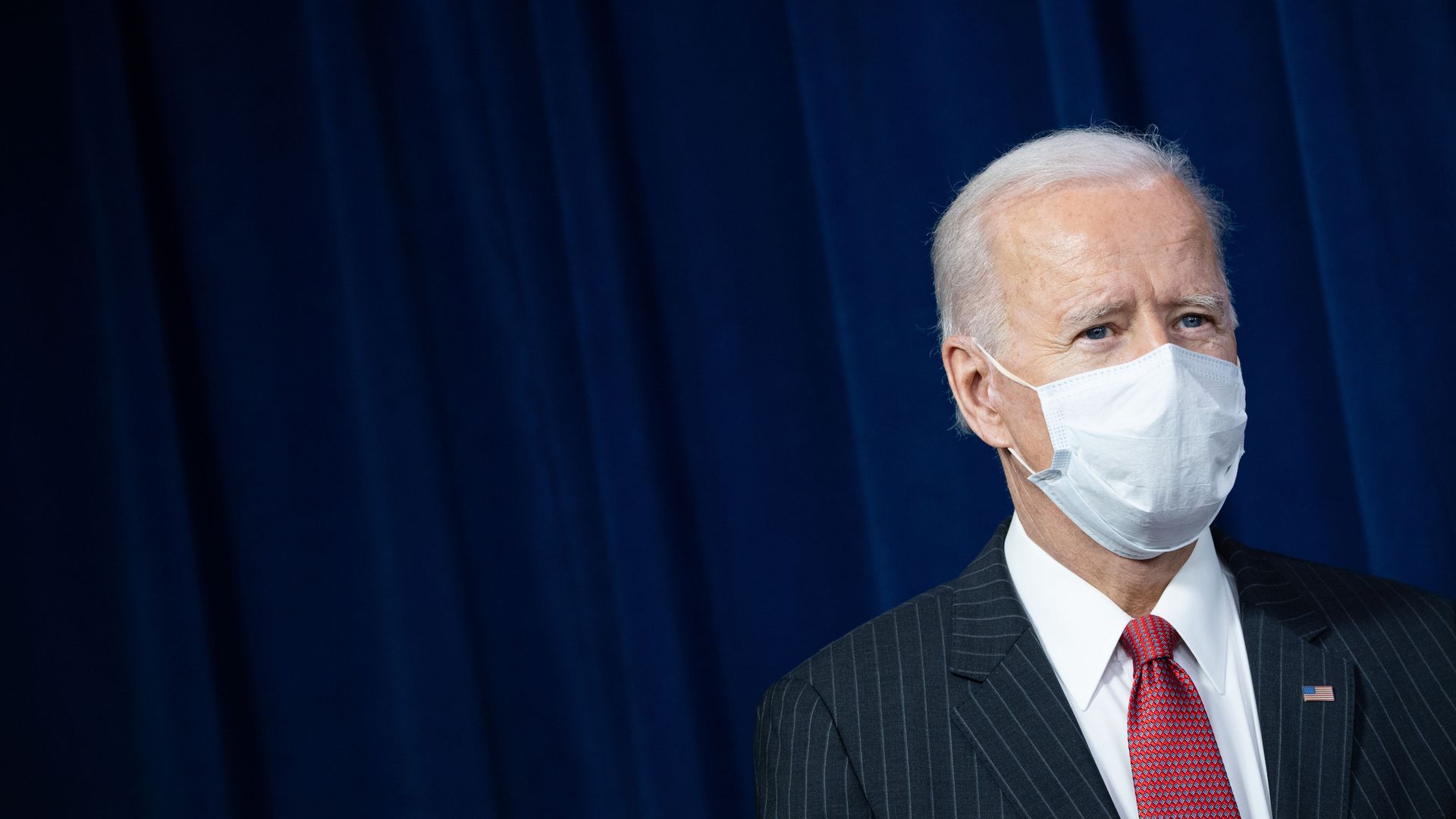 Photo of a masked Joe Biden's upper body
