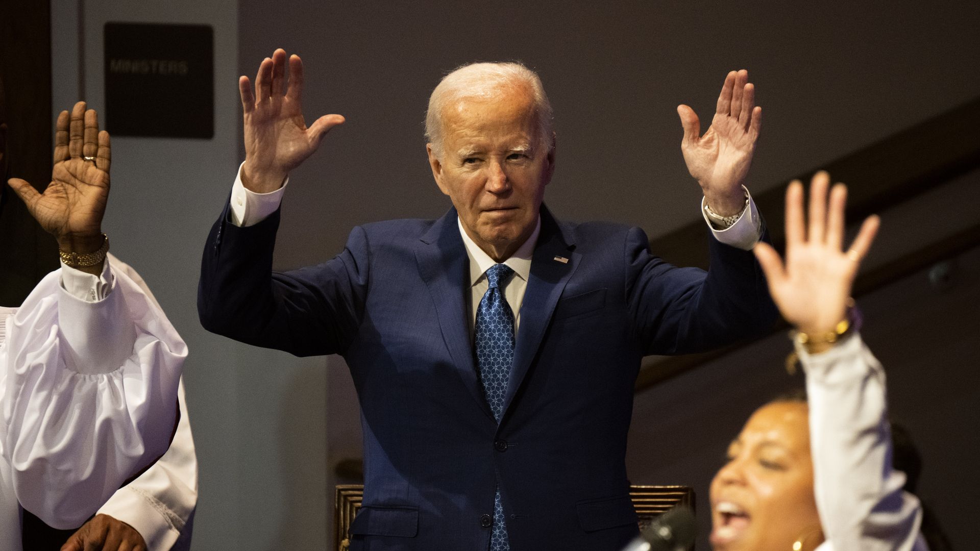President Biden raising his hands.