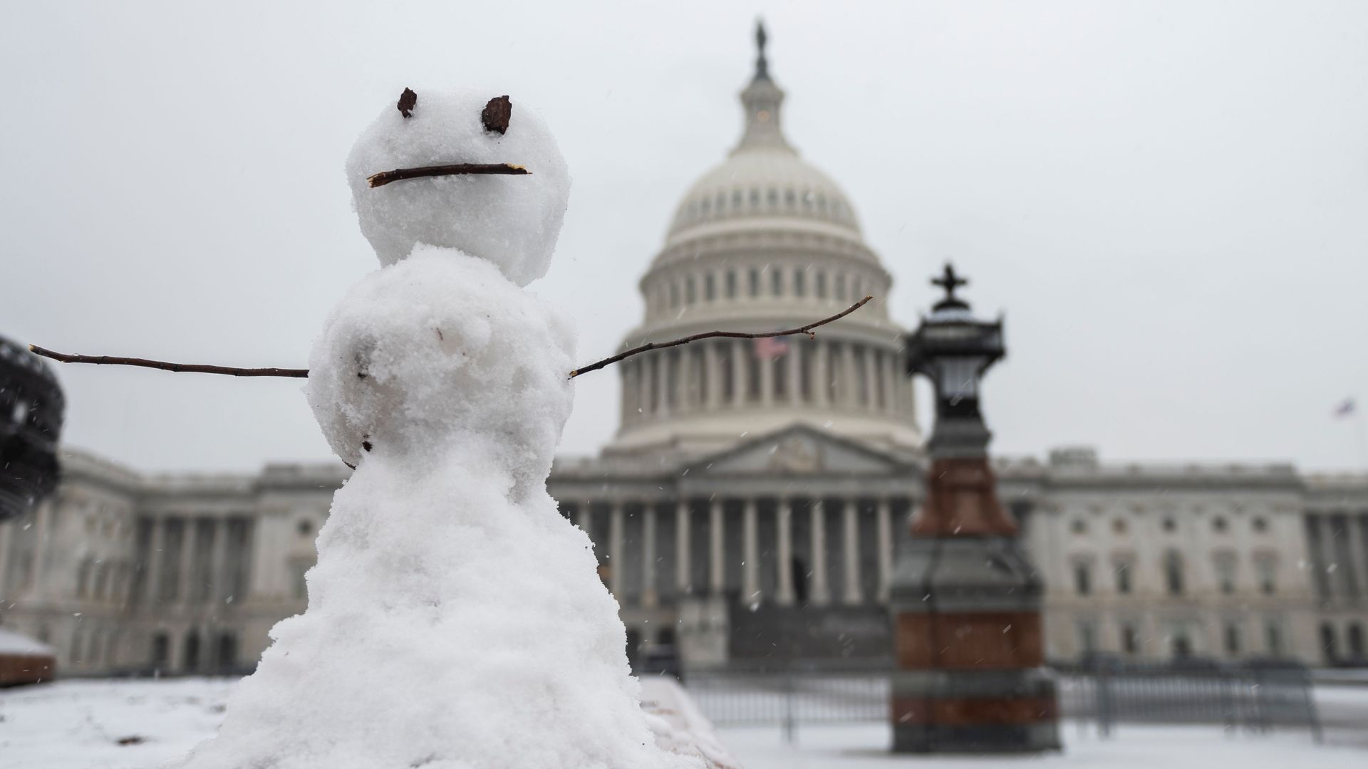 A snowman stands outside the U.S. Capitol as a storm moved through Washington, D.C.