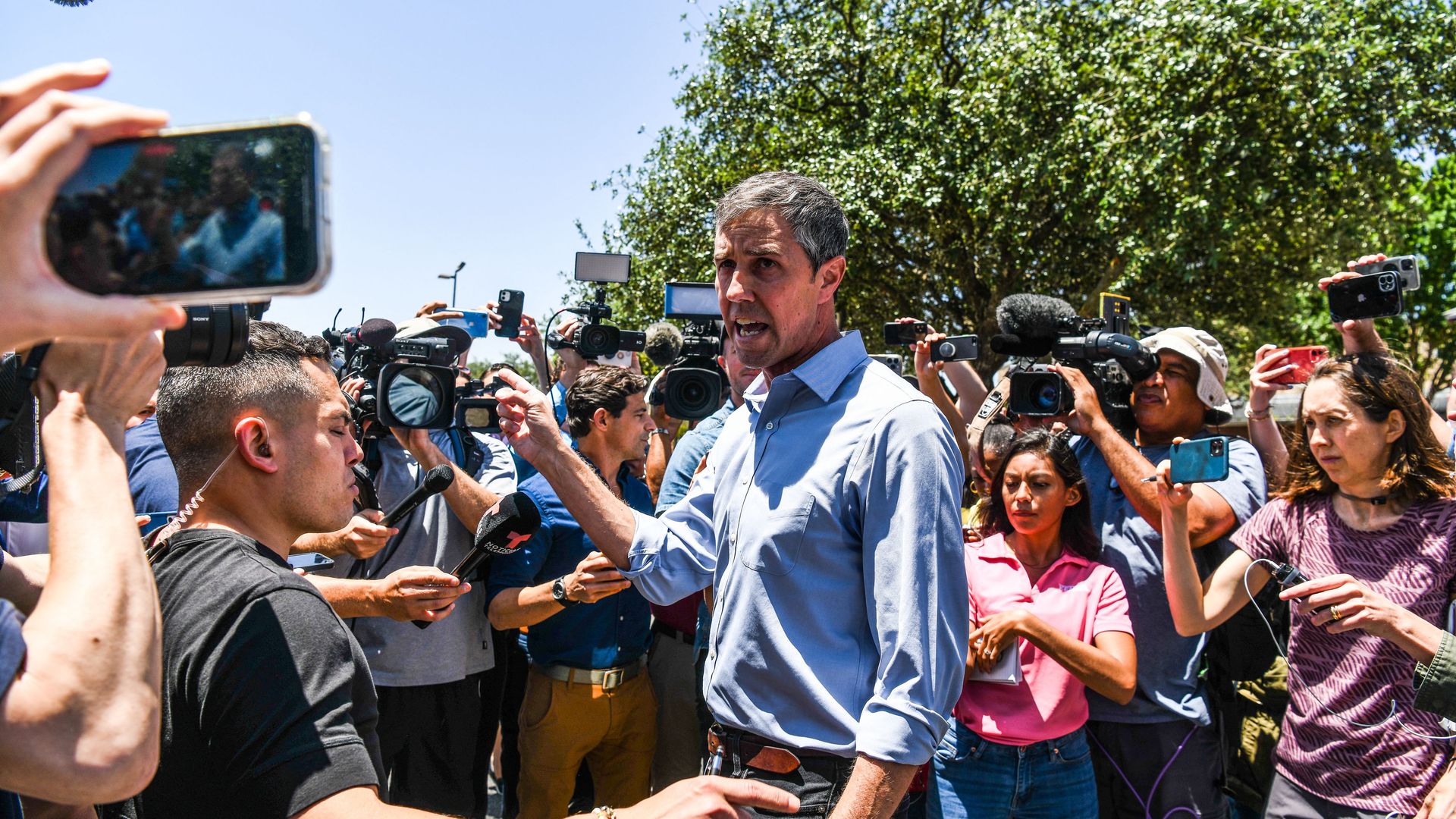 Beto O'Rourke surrounded by reporters
