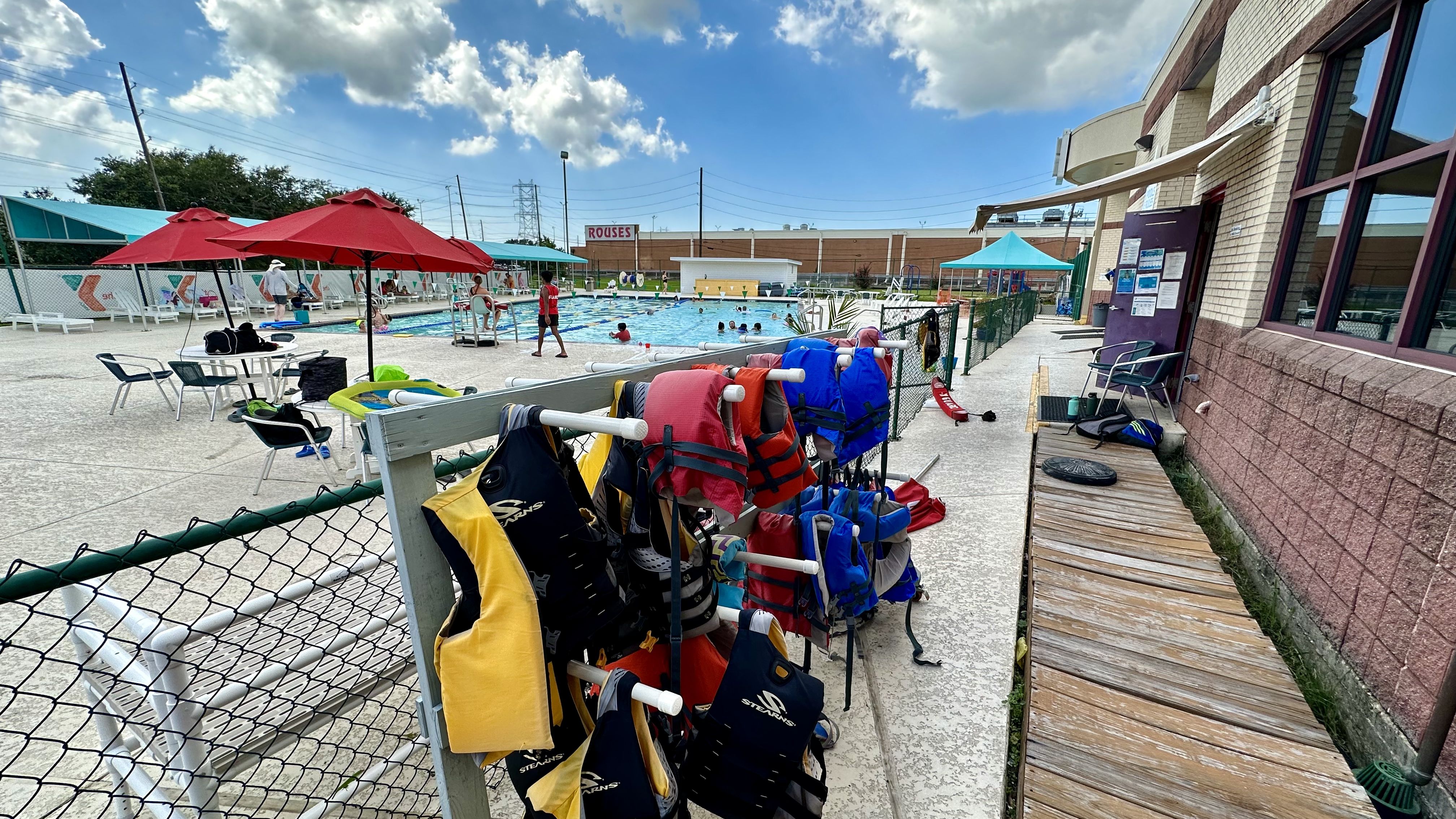 Photo shows lifejackets and a pool