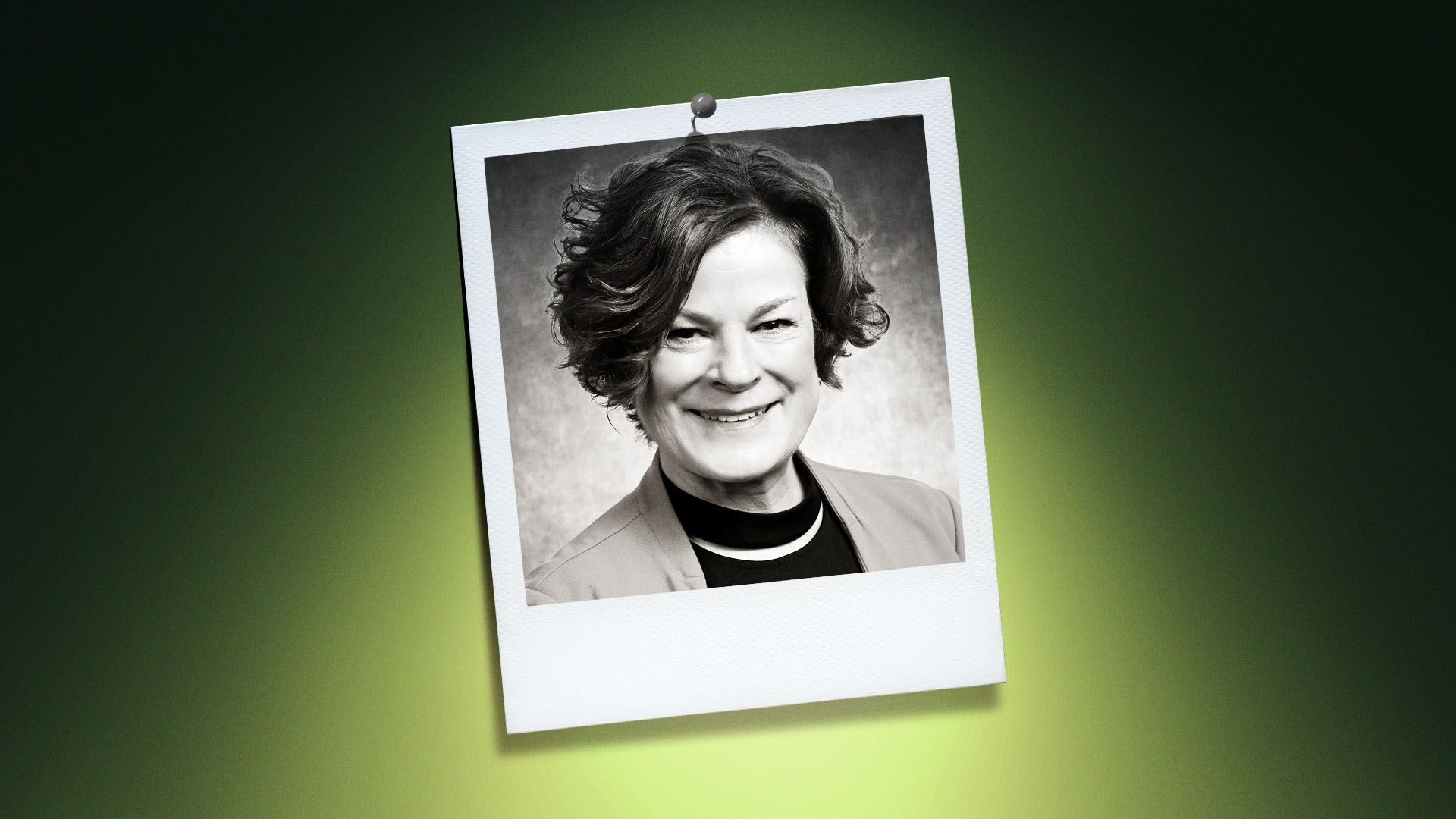 Photo illustration of Mary-Ann Baldwin in the center of a Polaroid photo under a green spotlight.