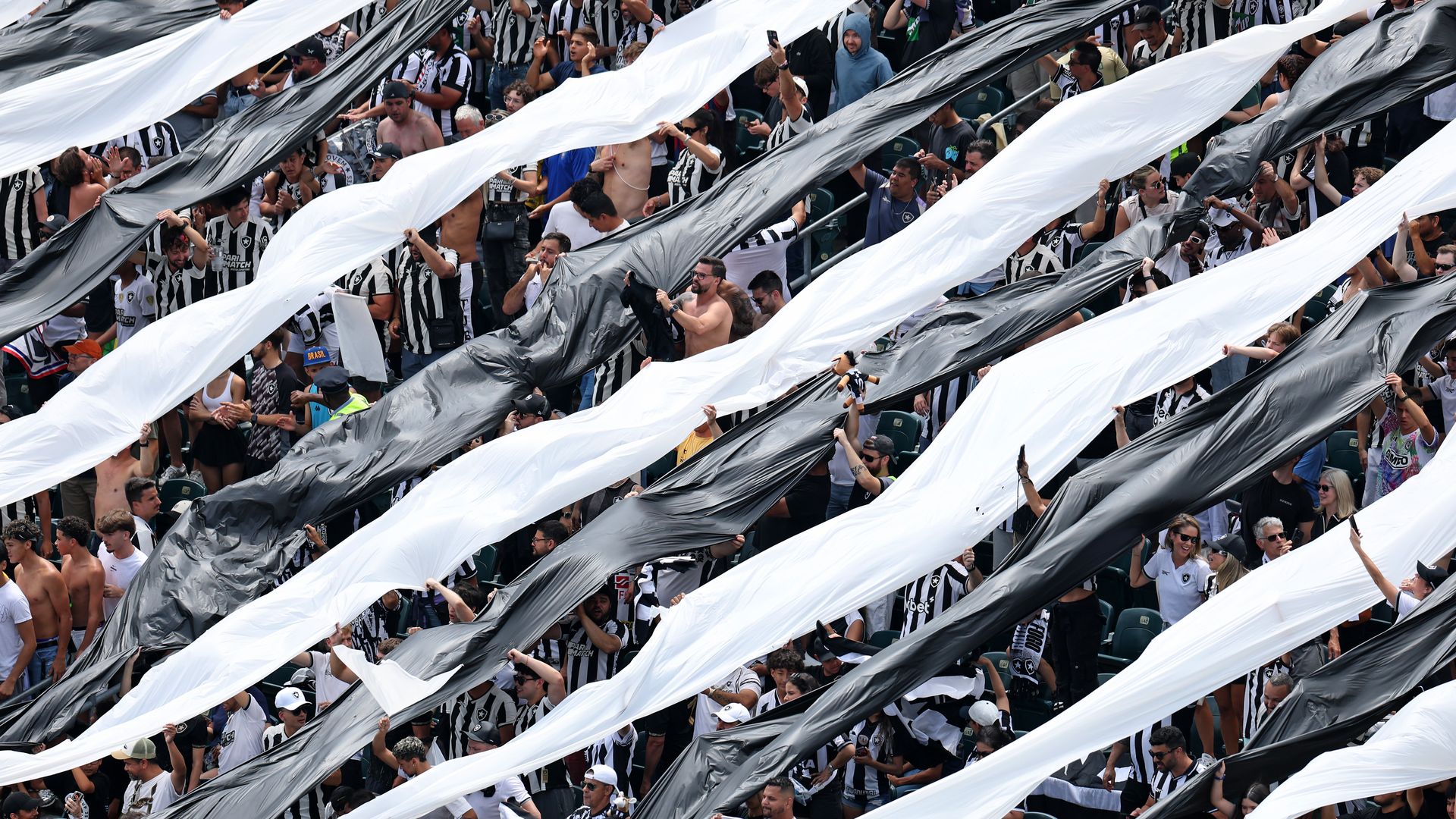 Botafogo fans holding up banners at the FIFA Club World Cup 2025 round of 16 match between SE Palmeiras and Botafogo FR at Lincoln Financial Field.
